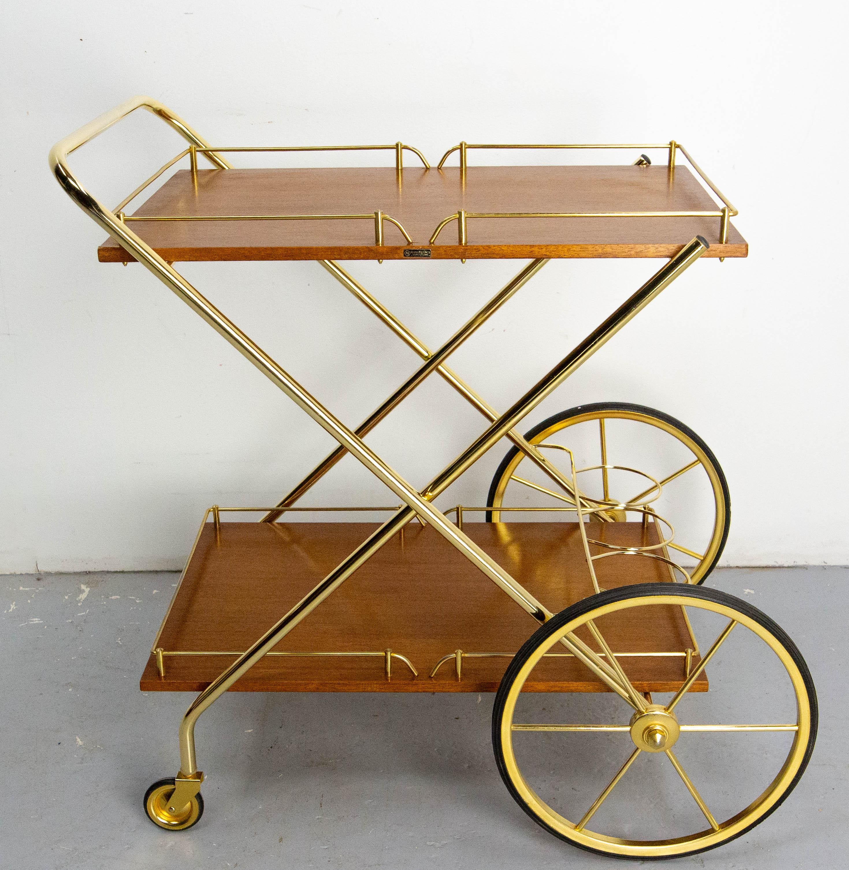 Vintage bar cart drinks or cocktail trolley, 
French, circa 1970, teak and brass.
The ManuFrance manufactures (1887-1980) were among the first French manufacturers to sell by catalog throughout France.
This trolley will be delivered dismantled.
A