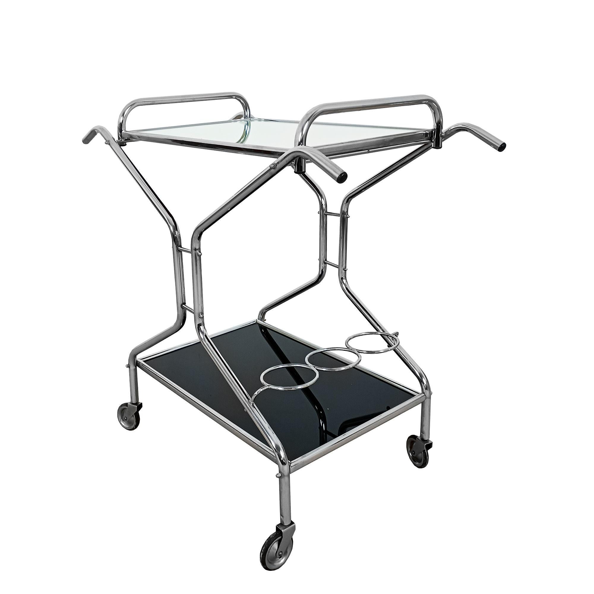 Nickel-plated metal serving trolley, black opaline base, removable upper tray covered with a mirror.

France circa 1950

Dimensions

Total 
cm 81 x 41,5 x 76,5
inches 31.89 x 16.34 x 30.12

Tray
cm 60 x 35,5 x 10
inches 23.62 x 13.98 x 3.93