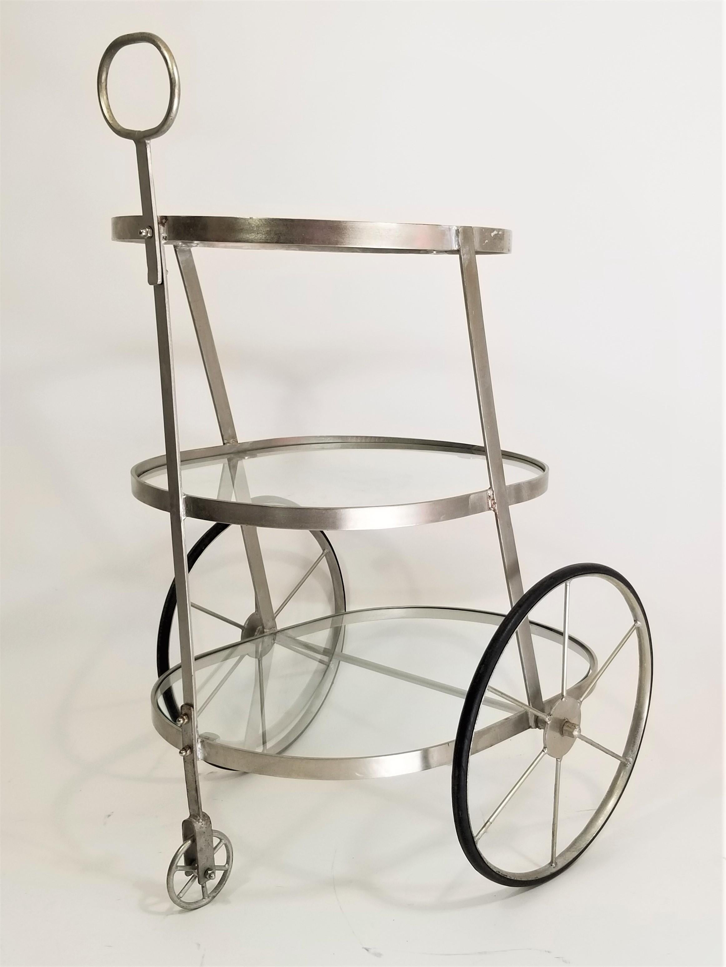 3-tiered glass and steel bar cart. Midcentury. Art Deco and Italian influence. 

Complimentary delivery in NYC and surrounding areas can be arranged for this item.