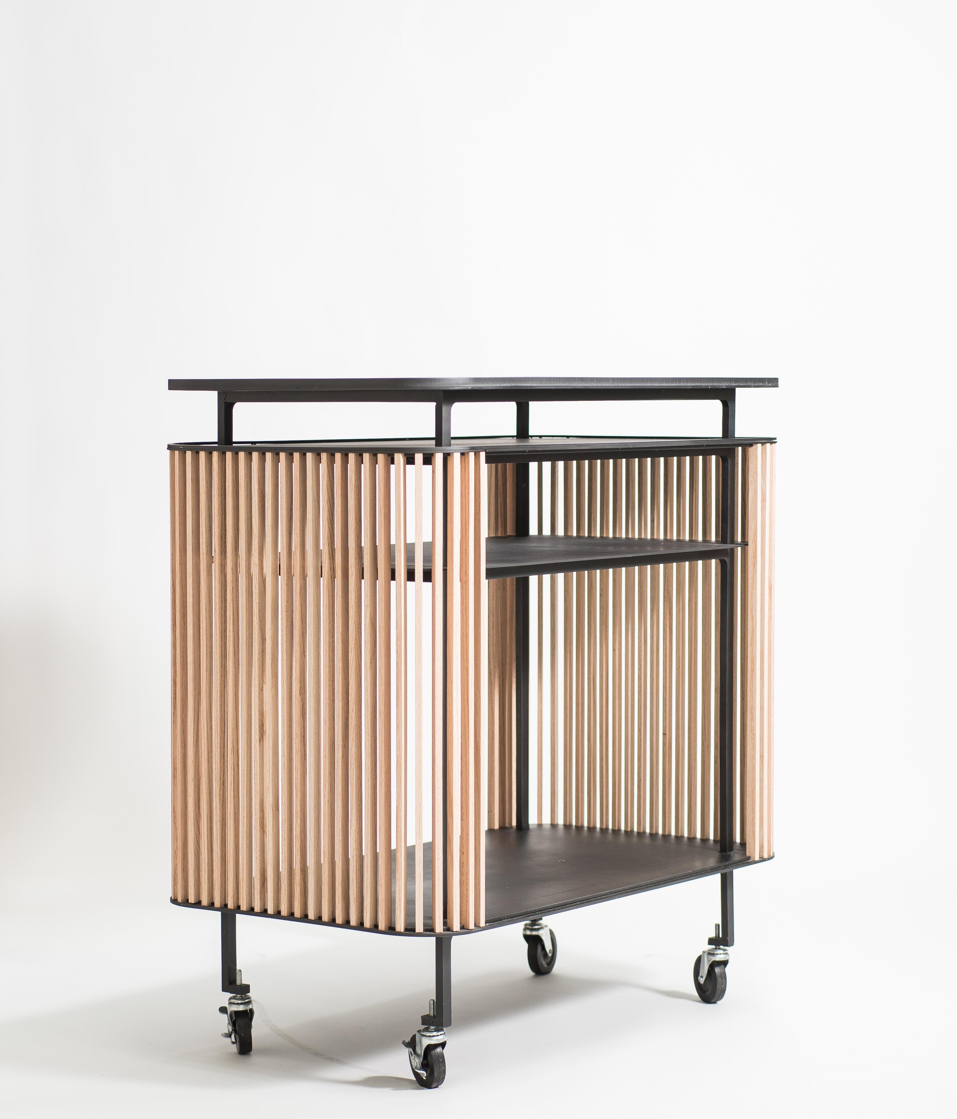Bar cart has been developed as a new addition to our favourite dry bar unit. The curvaceous laser cut steel form is adjusted to allow for mobility and with removal of door hardware, the piece functions as a lighter, more porous movable bar cart. A