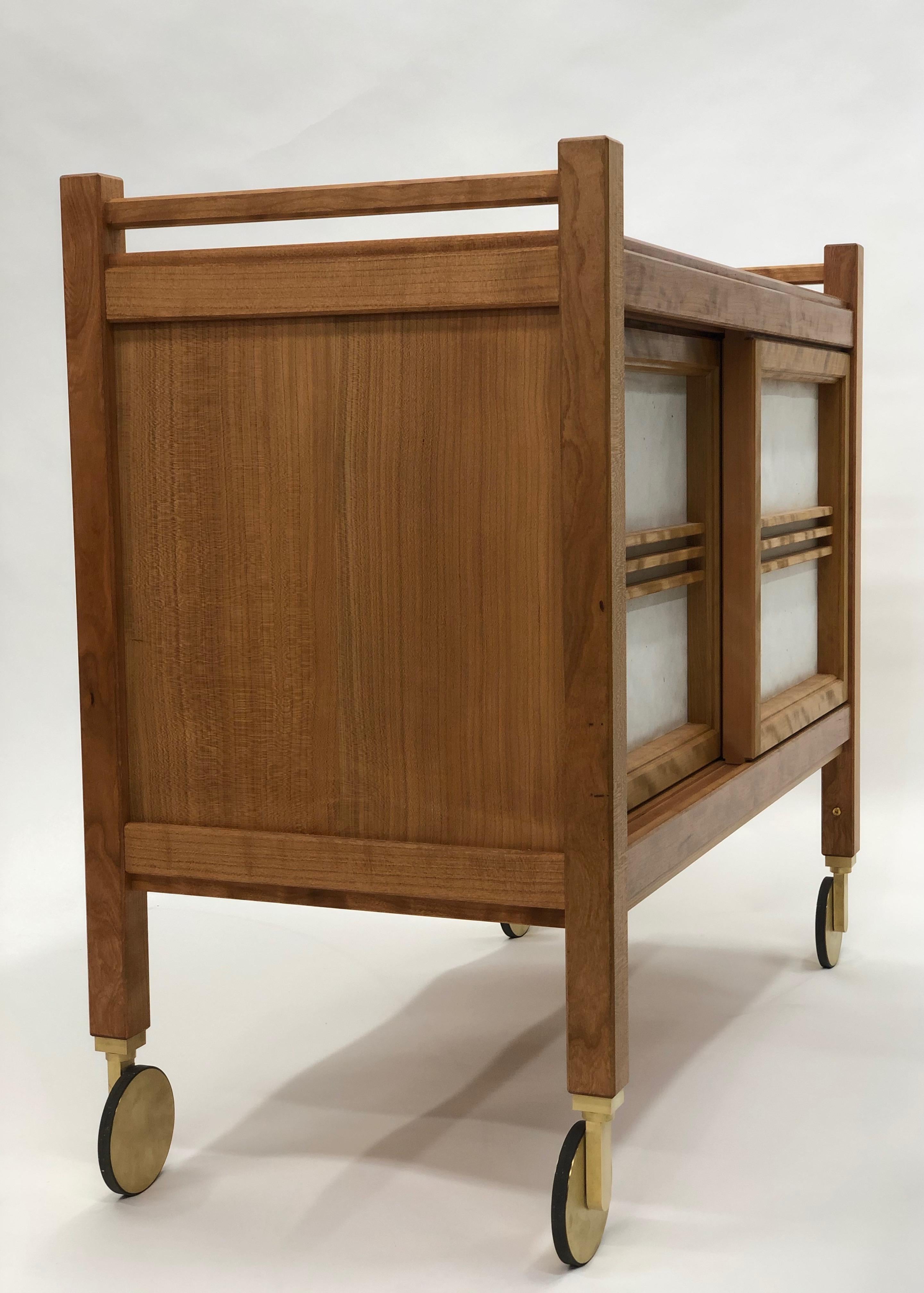 Blending my influence of sashimono craftsmen and that of finely finished and carefully machined brass hardware to create a bar cart which is built using traditional handmade wood joinery with that of manually machined brass casters.

This rolling