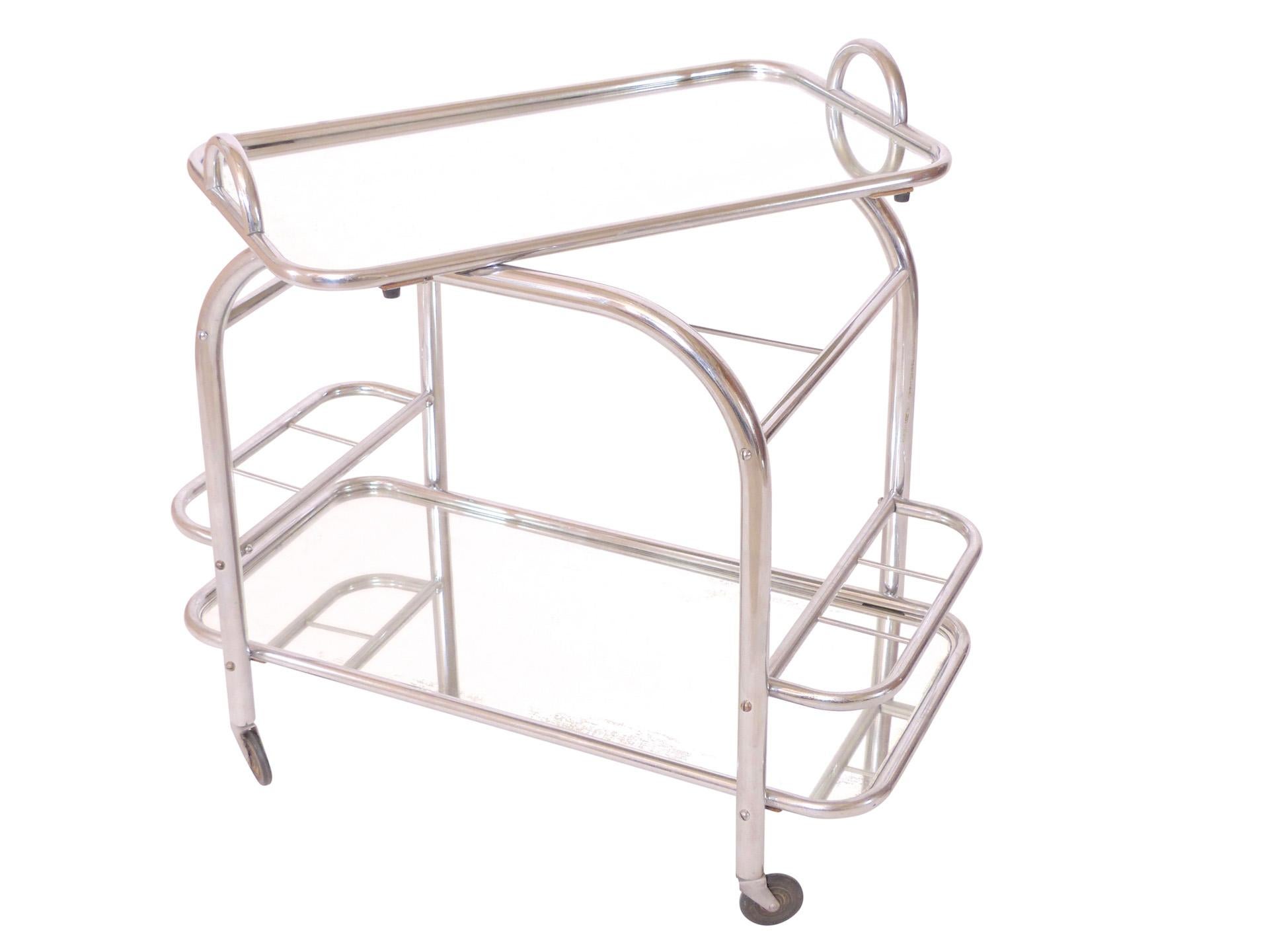 Art Deco Bar Trolley / Tea Wagon
Original Chrome 
Original Mirrors 
Removable Tray 
French Art Deco, 1930s 

Pictures take in a warm lighted ambience. 
Surface is chromed! 
