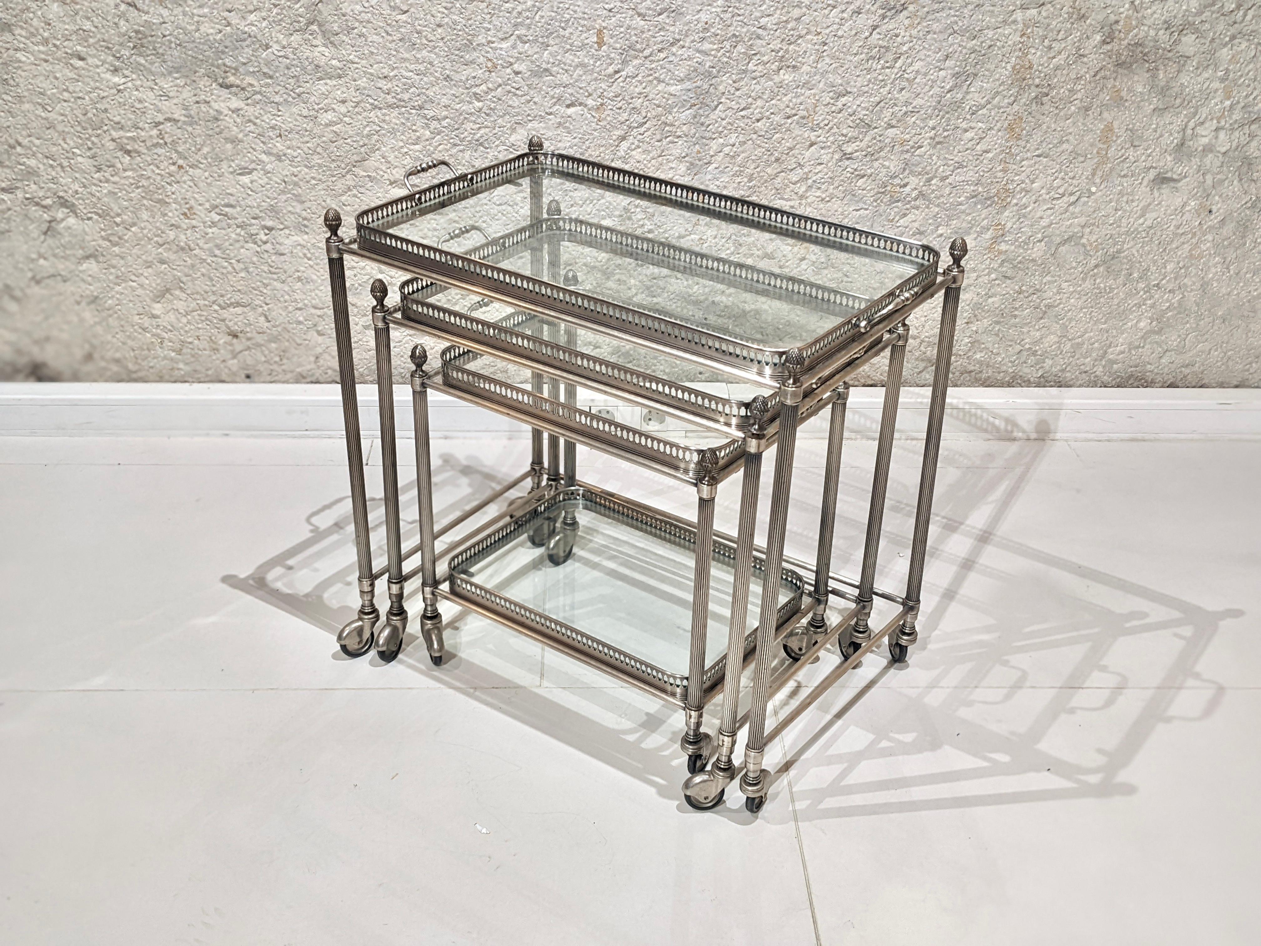 Bar Cart jansen house in silver plated metal. 

Circa 1960
Very good condition. 
It consists of a silver plated metal structure and 4 glass trays (see picture).

Dimensions : W63 cm x D39 cm x H62 cm 
