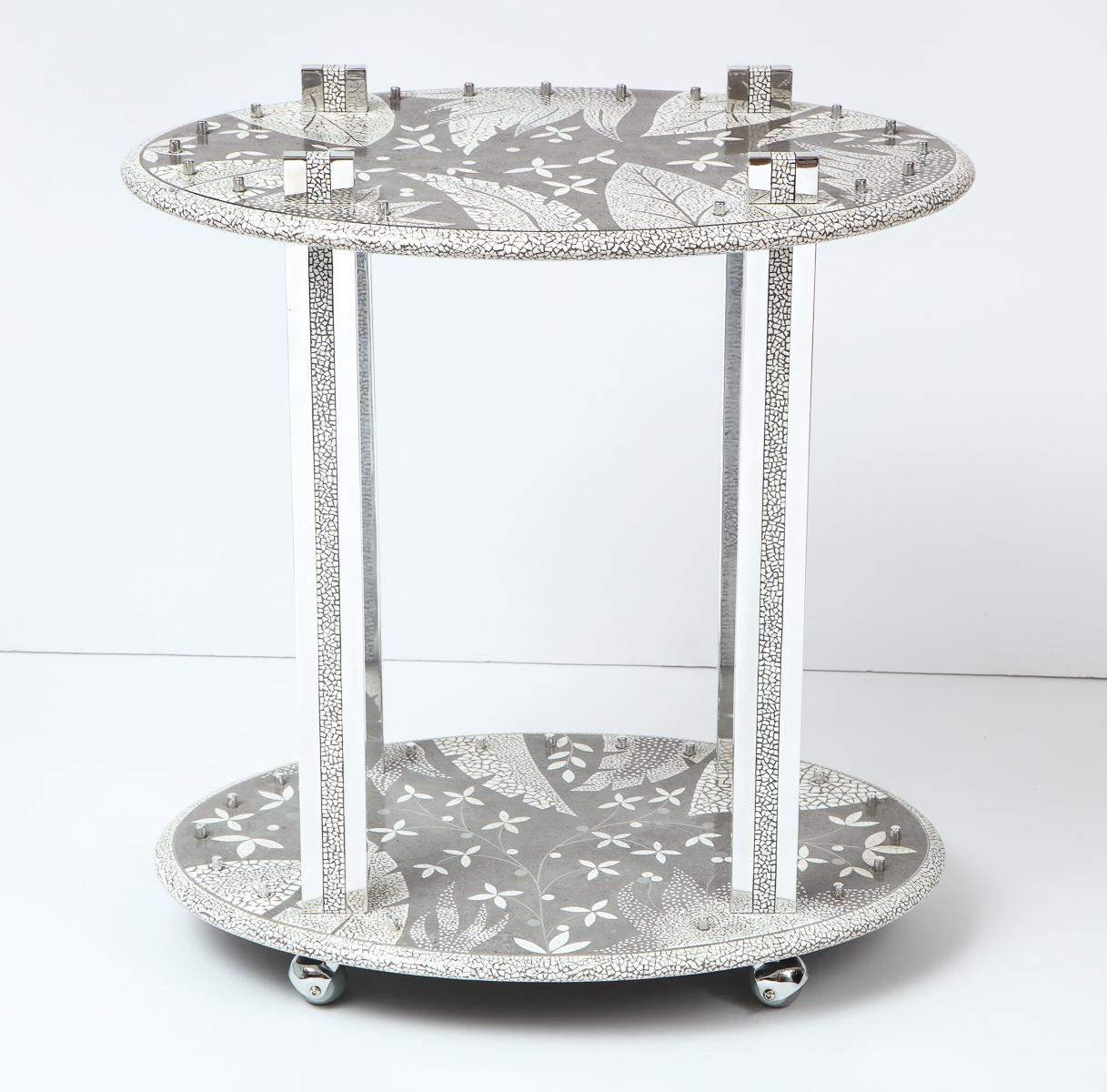 Decorative bar cart from South Africa. The beautiful pattern is an inlay of ostrich eggs, in cement with details of aluminum.