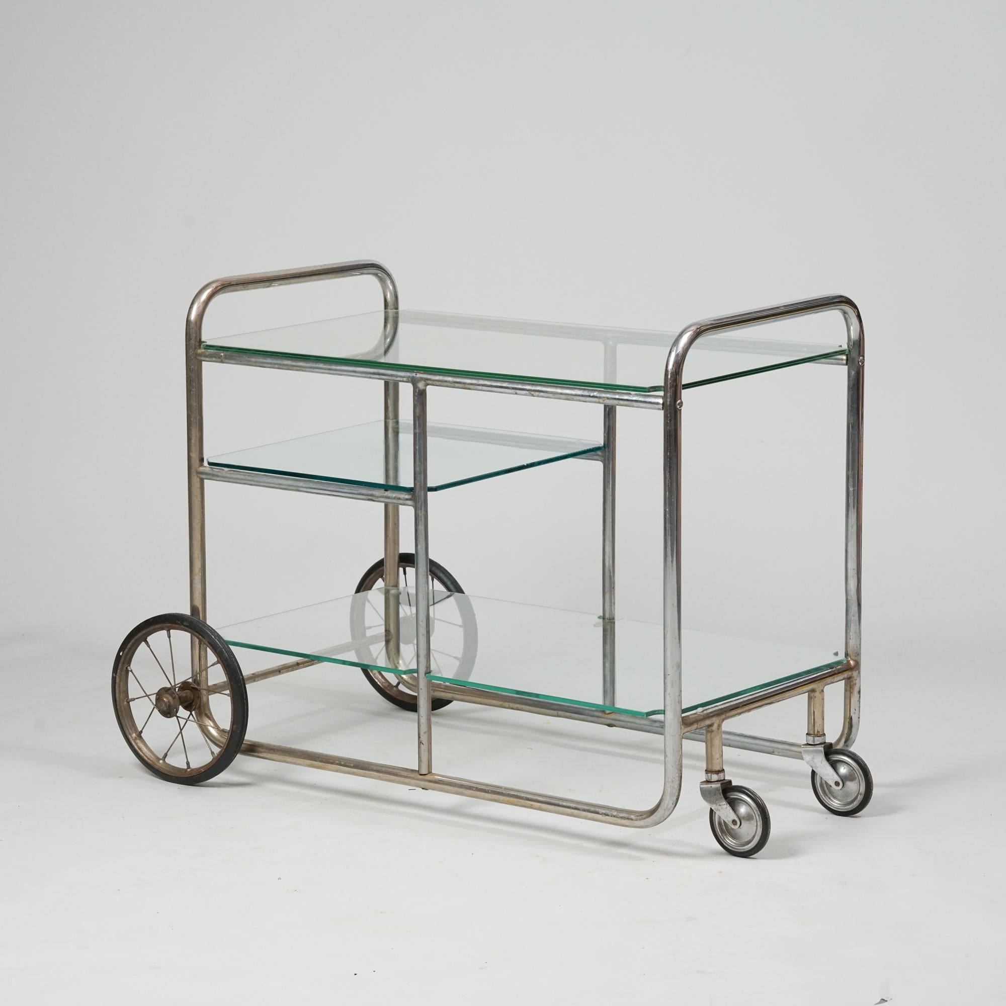 Bar Cart, designed by Pauli E. Blomstedt, manufactured by Heteka, Finland, 1930s. Metal frame with green glass. Good vintage condition, patina and minor wear consistent with age and use. 