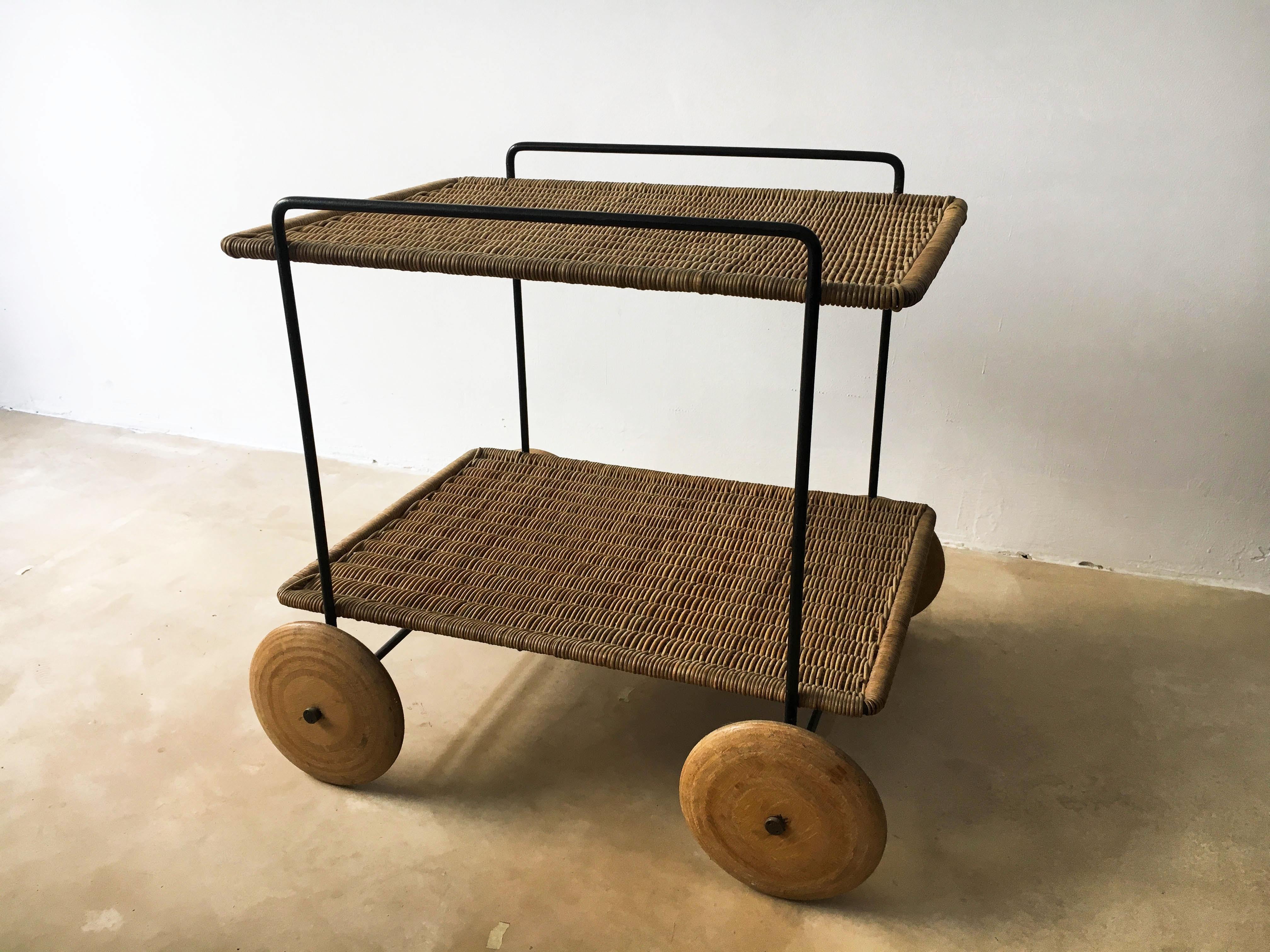 Carl Auböck II Vintage Bar Cart Serving Trolley, Iron & Wicker, Austria 1950s. Black painted metal frame, wicker shelves and plywood wheels - all is was intended to be. One of the finest pieces to come from the Werkstätte Auböck and the perfect