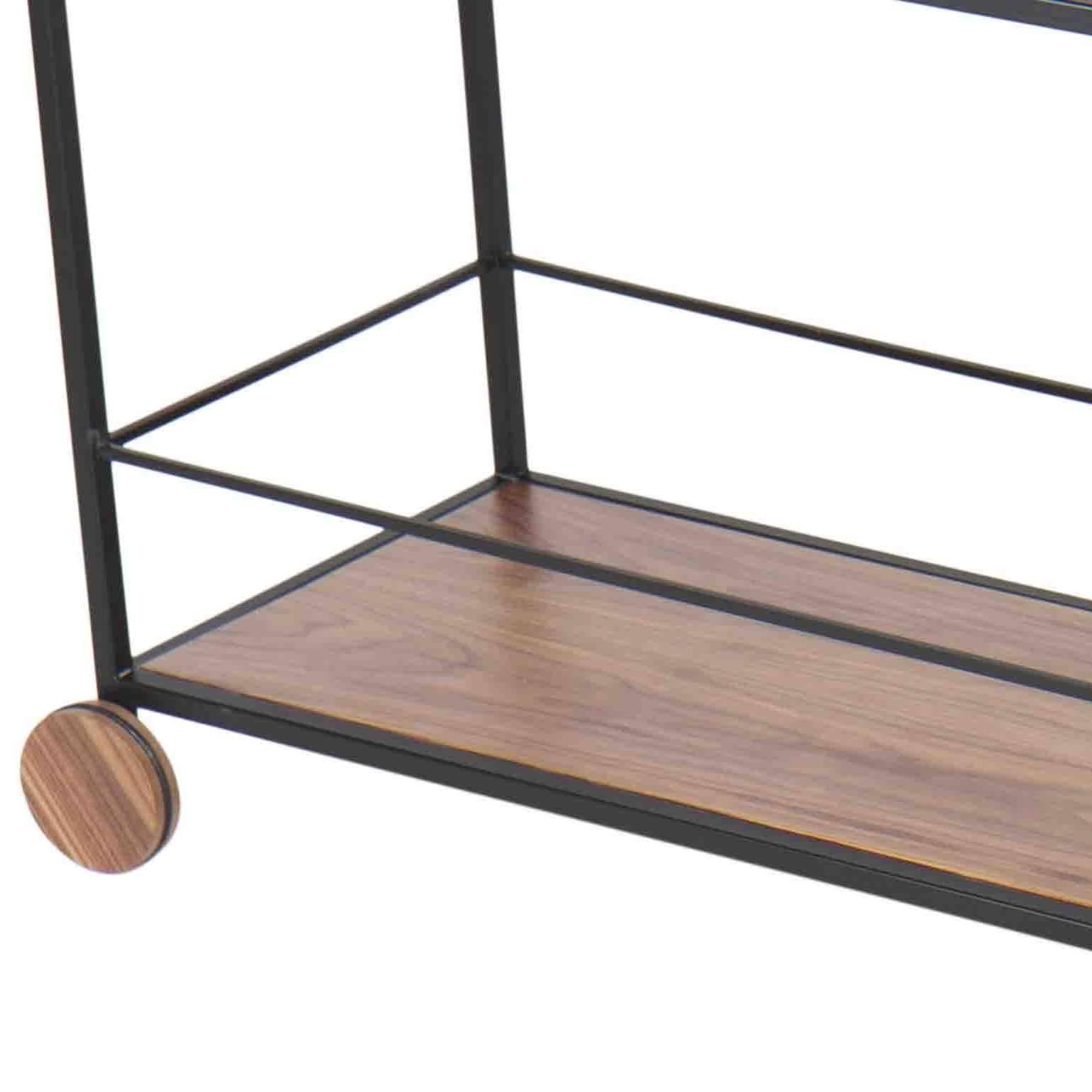 Bar or tea trolley, or sideboard, in full size. With structure and design in carbon steel painted in black, with functional support drawer in catuaba wood and glass top, with 4 wheels.

Item Details:
WOOD: EBONIZED JEQUITIBA WITH EXTRA CLEAR GLASS