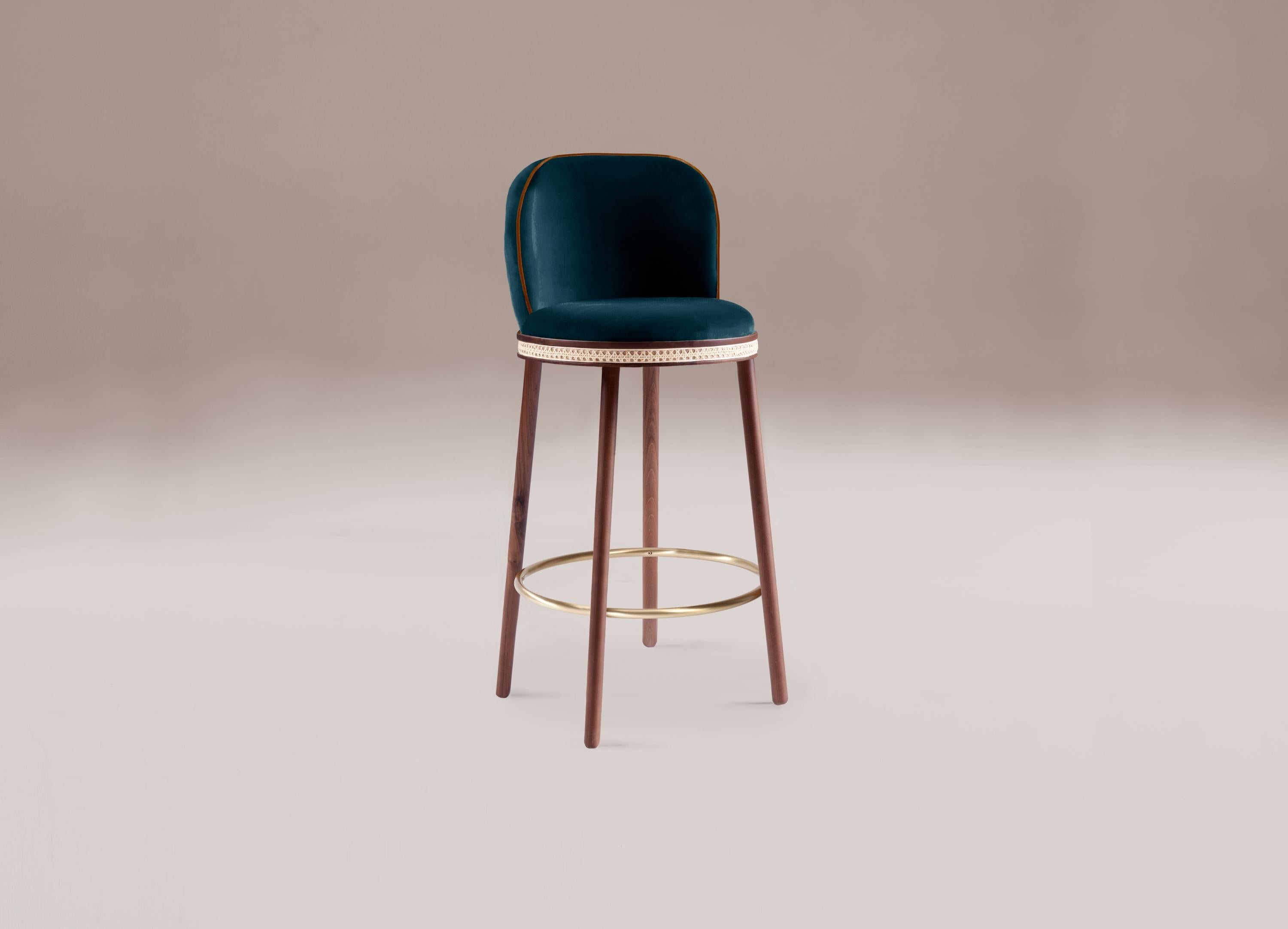 Bar chair - Alma by Dooq 
Dimensions:
W 46 cm 18”
D 51 cm 20”
H 100 cm 39”
seat height: 75 cm 30”
Materials: upholstery fabric or leather; structure solid wood feet lacquered MDF or solid wood rattan natural rattan. COM with natural walnut or