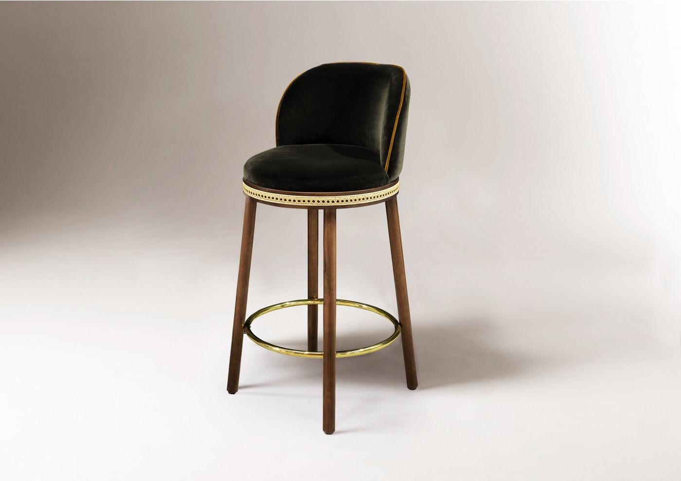 Bar chair - Alma by Dooq 
Dimensions:
W 46 cm 18”
D 51 cm 20”
H 100 cm 39”
seat height: 75 cm 30”
Materials: upholstery fabric or leather; structure solid wood feet lacquered MDF or solid wood rattan natural rattan. COM with natural walnut or