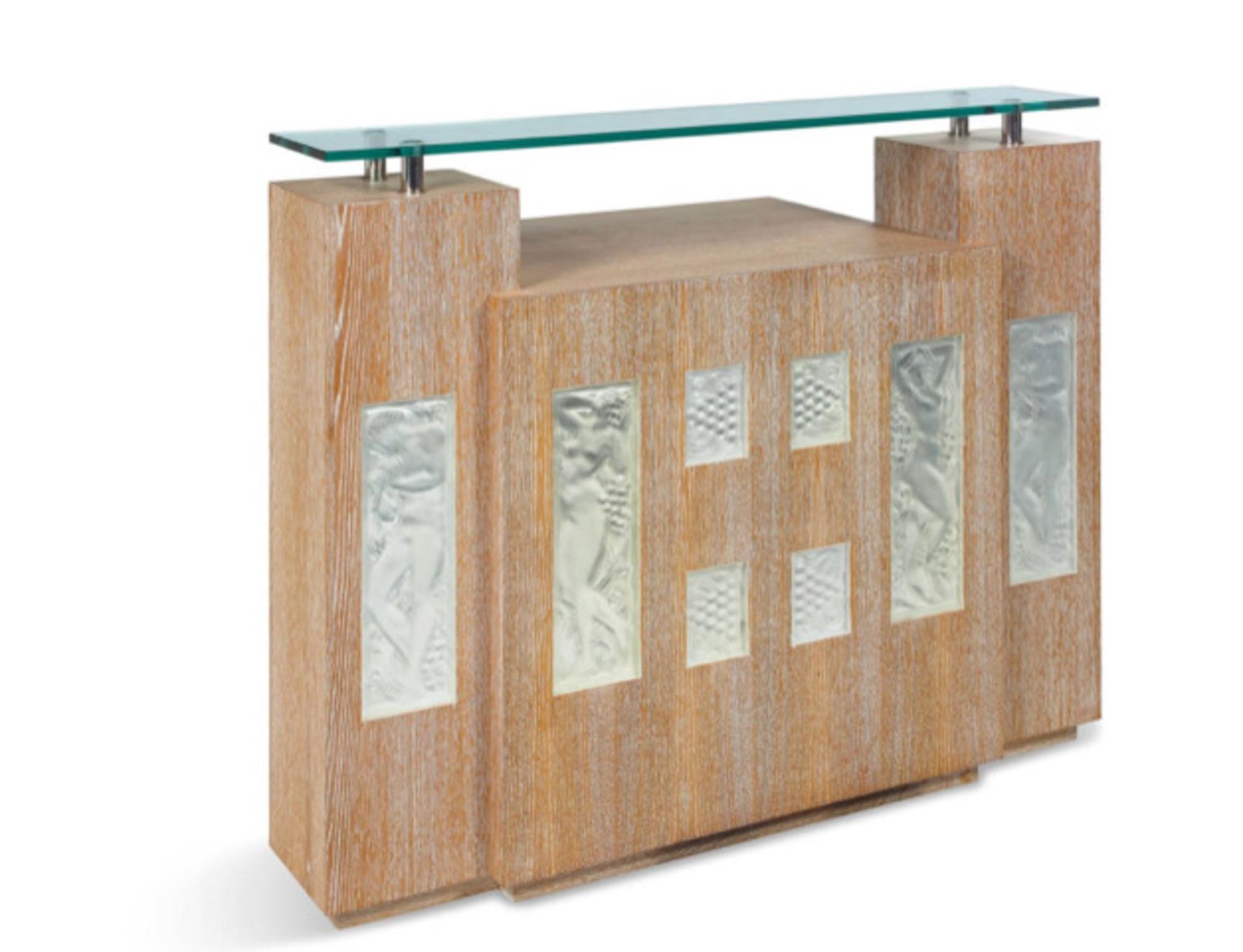 Bar in cherry oak composed of 2 columns with wooden shelves on the reverse side around the central buffet opening at the back with 2 doors.  Cristal console top mounted on nickel-plated metal supports.   On the front Eight Lalique Cristal plates