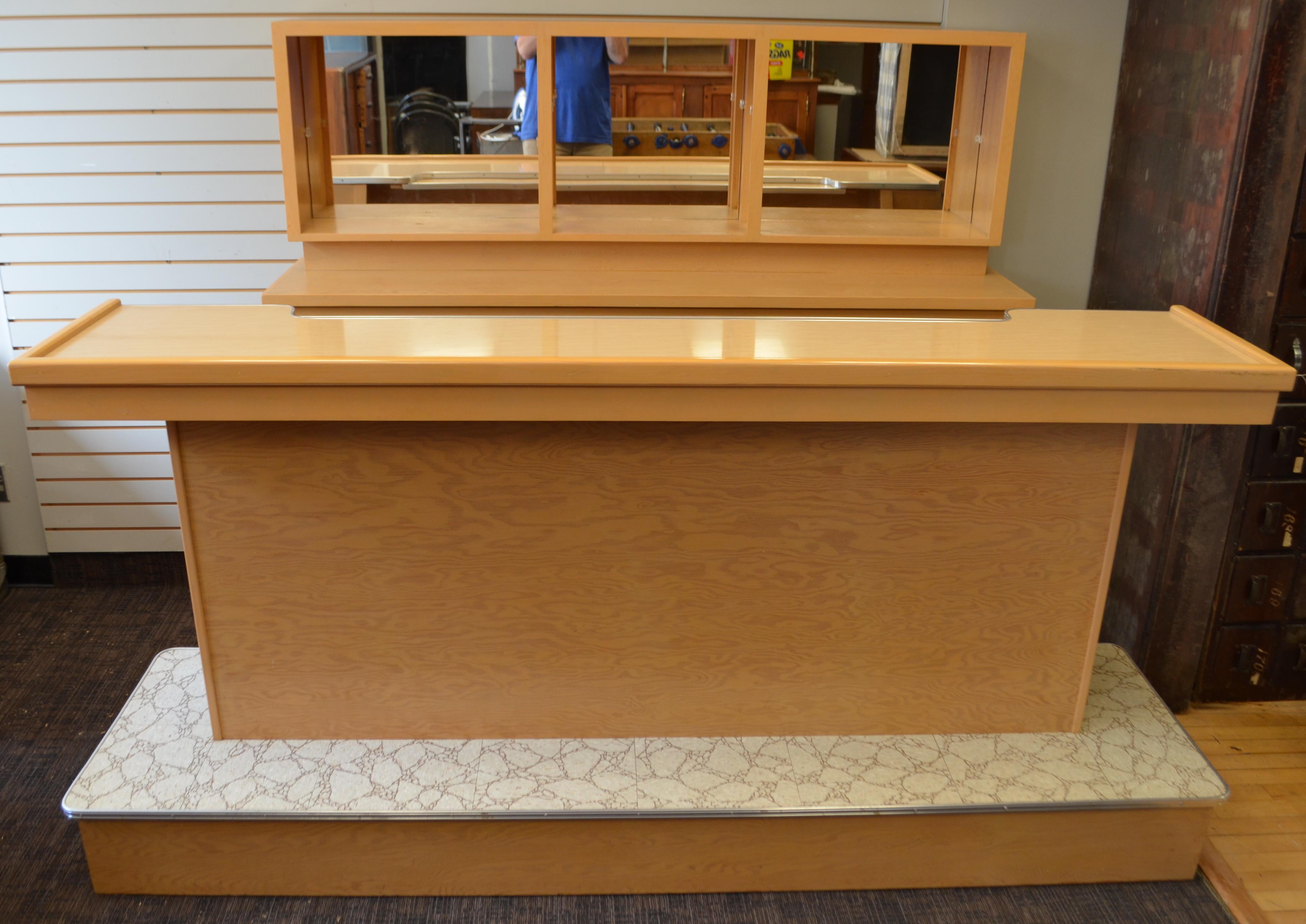 Classic mid century front and back bar for home and office events. You can even shift this from room to room or event to event if you choose since it's two freestanding pieces, neither very heavy. Offers prodigious storage. Perfect for