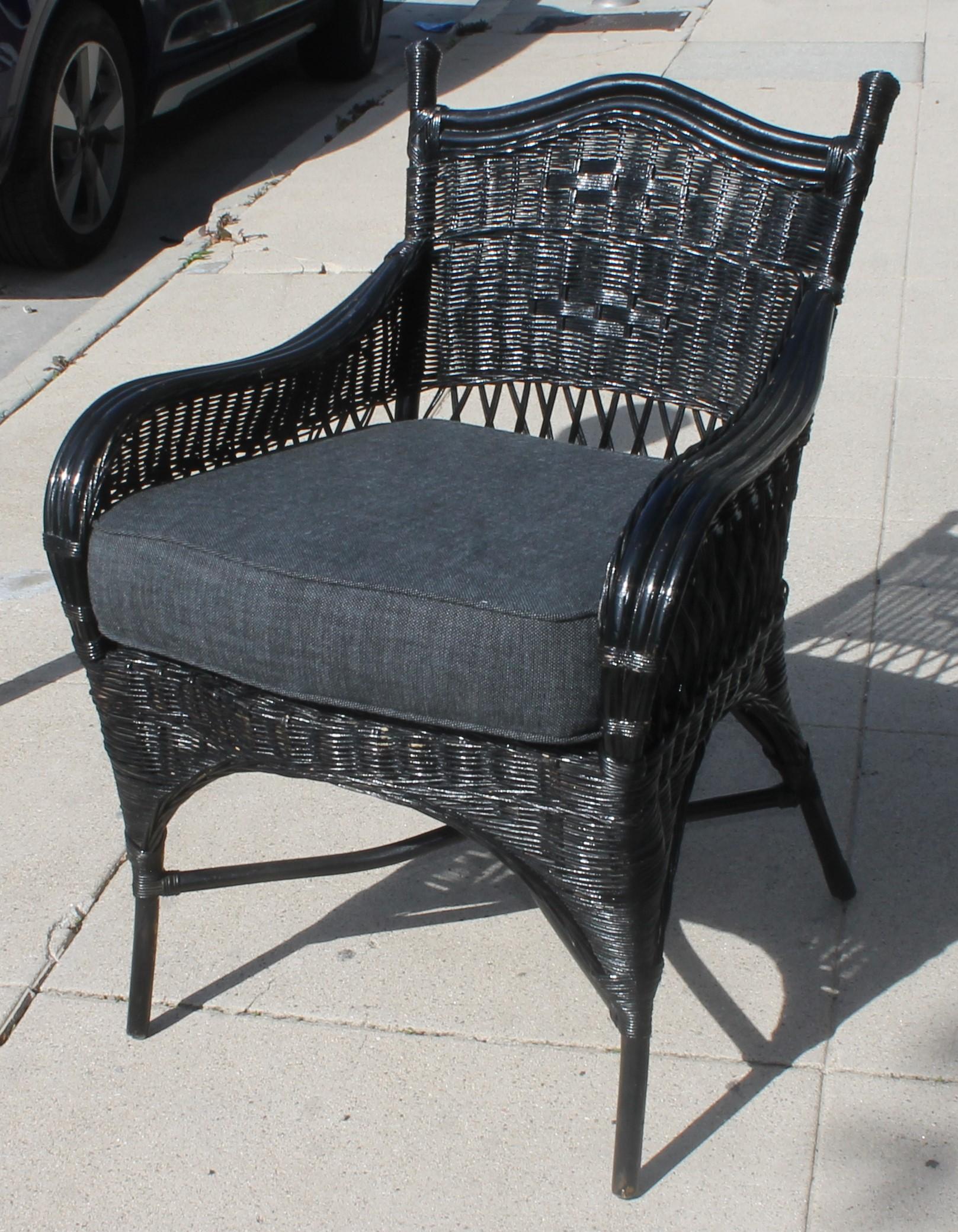 These amazing black painted wicker chairs are in a Bar Harbor style and have been sprayed with a all weather protector spray. These chairs also have custom made cushions for all weathers . The Sunbrella performance fabric used will protect the