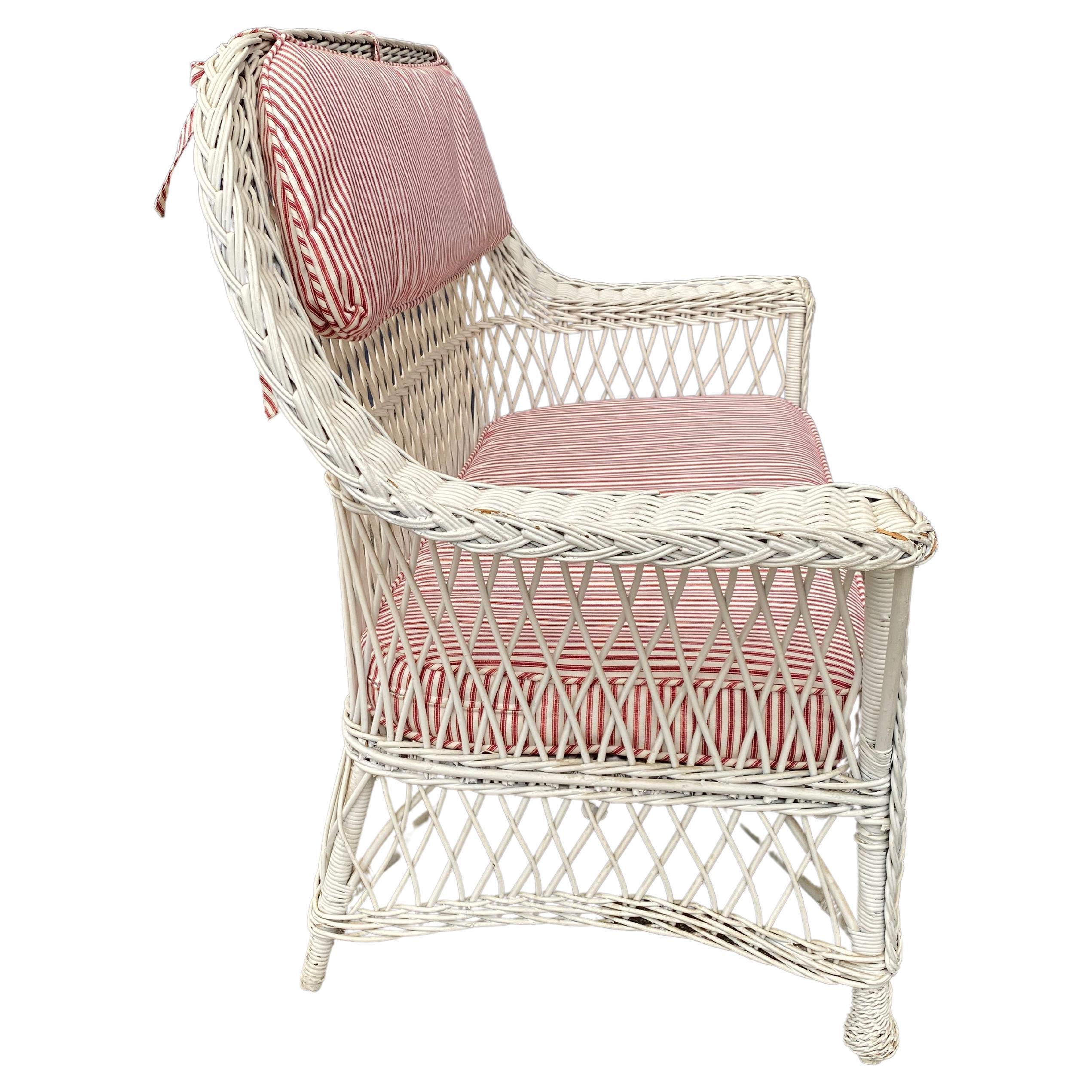 This is a very good example of a Bar Harbor Wicker settee that dates to the first half of the 20th century and is a great example of the current coastal decorating trend. The settee is in remarkably good original condition (it has been repainted in