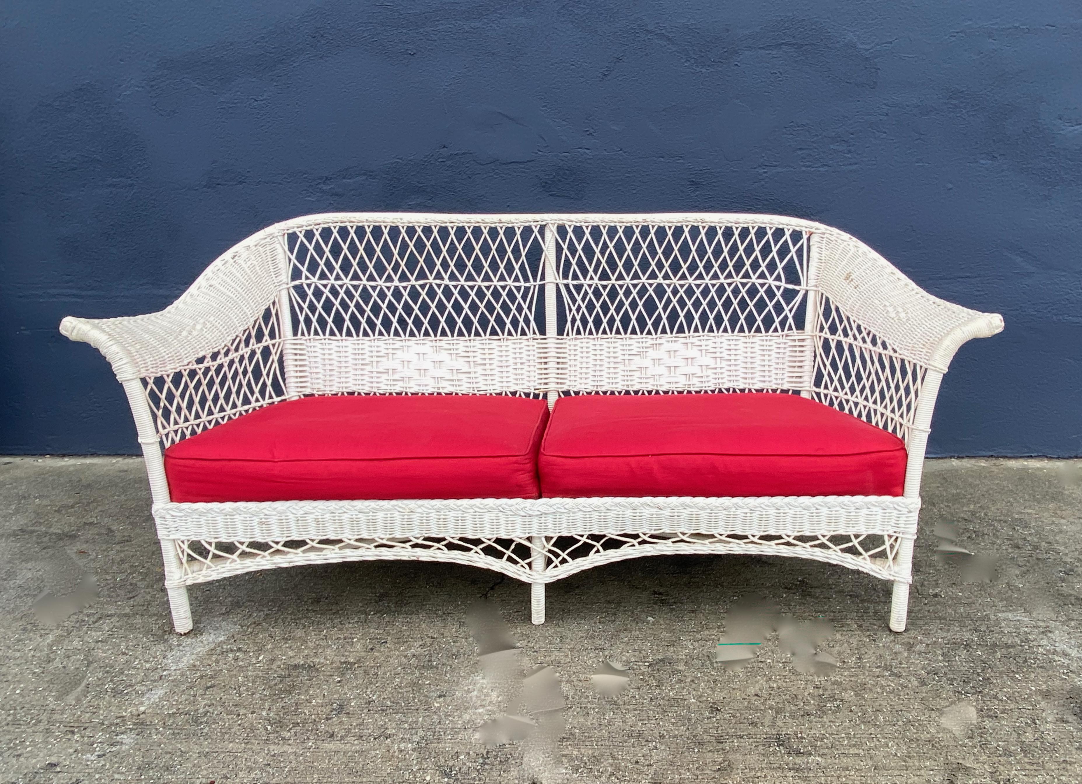 This is an iconic Bar Harbor Wicker sofa that dates to the first half of the 20th century. The sofa is a great example of the current Coastal Design trend and can be placed inside or out--if under a covered veranda or terrace. The sofa is in overall