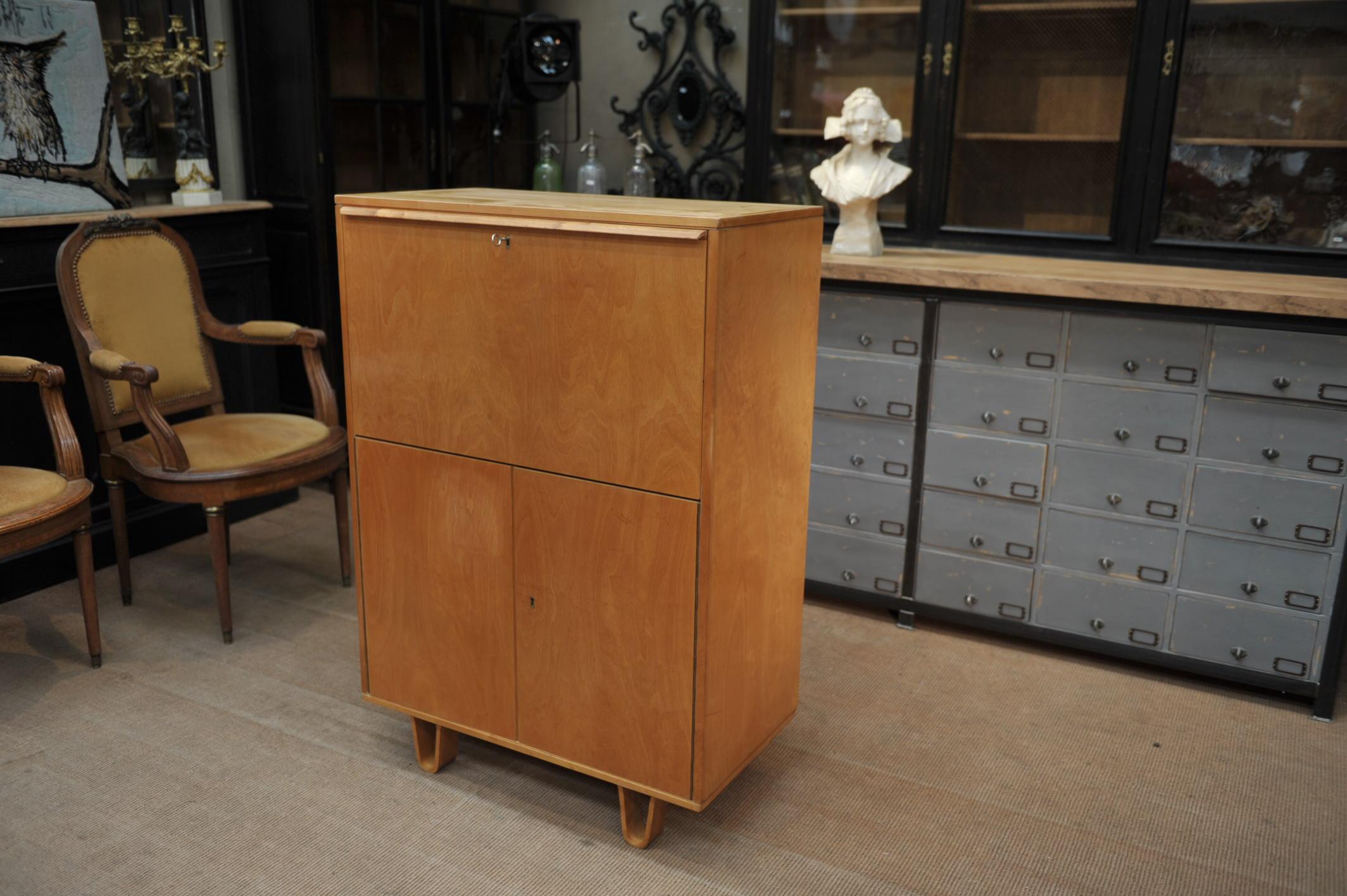 Bar or writing desk model CB07 in birch wood, 2 doors and one flap door an 2 drawers inside with original tag of retail seller designer: Cees Braakman for Pastoe, 1950s.