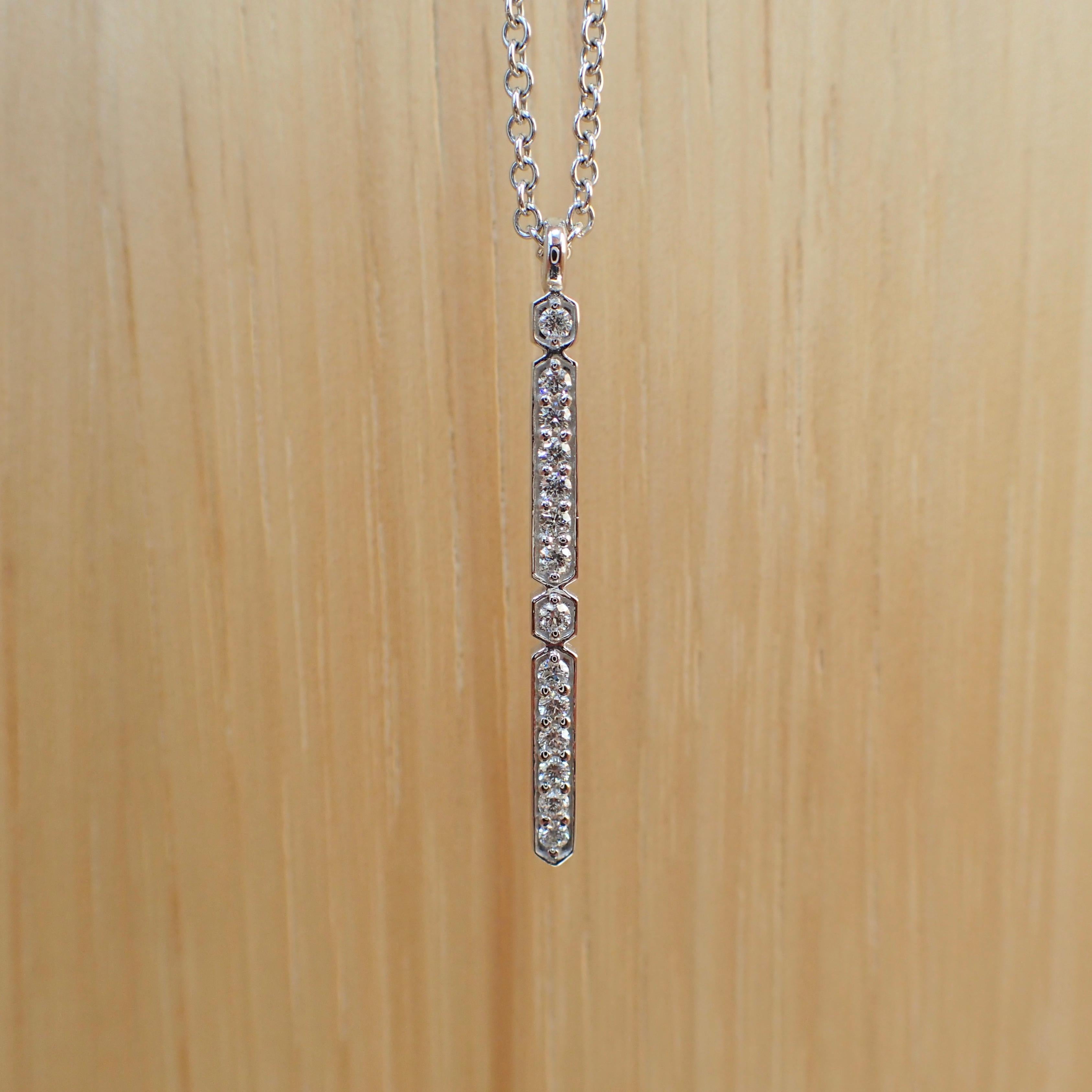18k White Gold 24” long 1.5mm Cable Chain with Pendant that contains fourteen (14) 1.5mm Round Brilliant Cut Diamonds that weigh a total of 0.21 carats and have Clarity Grade VS and Color Grade G. The diamond bar is 1.25
