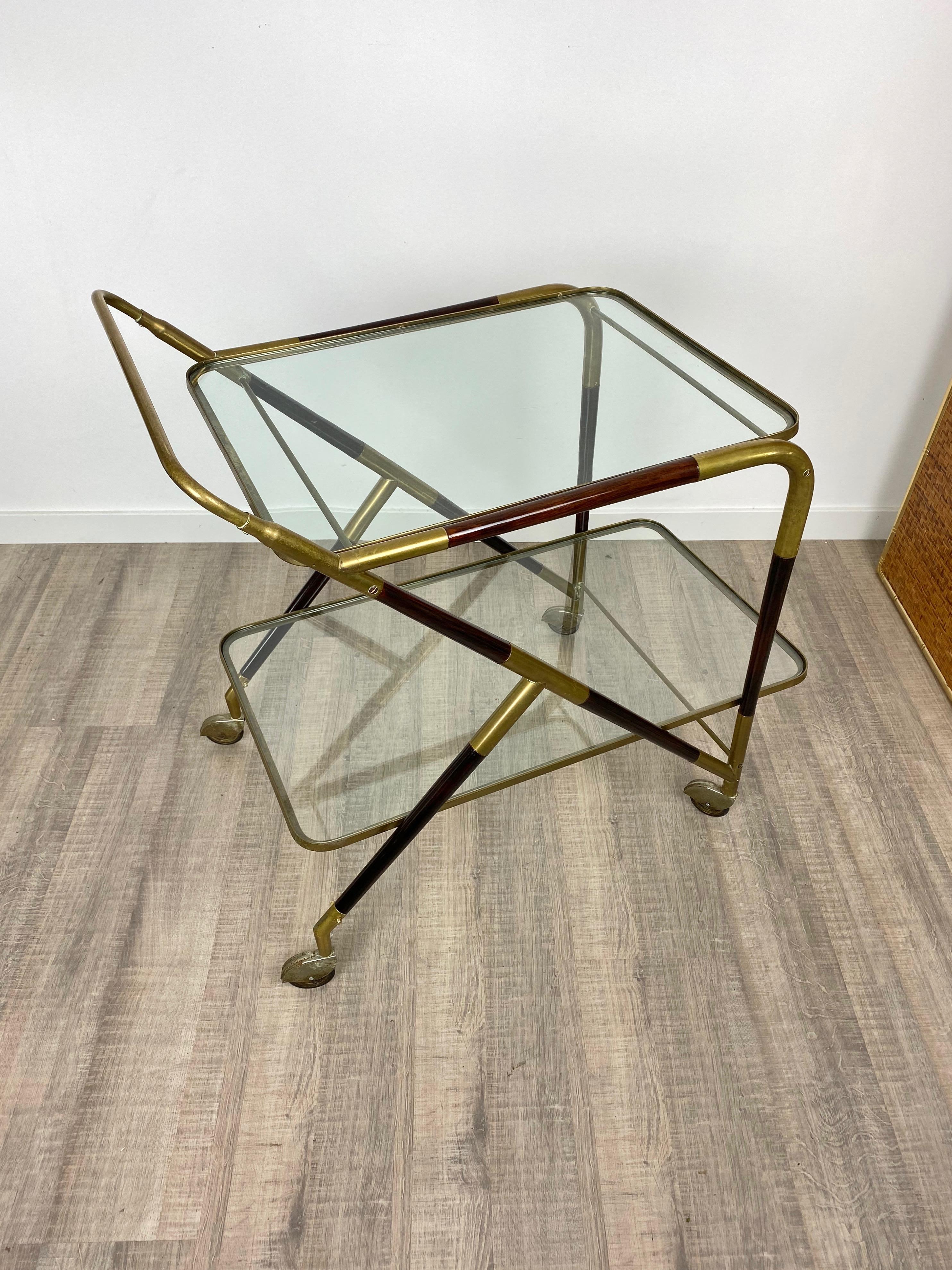 Bar serving cart trolley by the Italian designer Cesare Lacca in a mahogany and brass structure and two glass shelves, Italy, circa 1950.