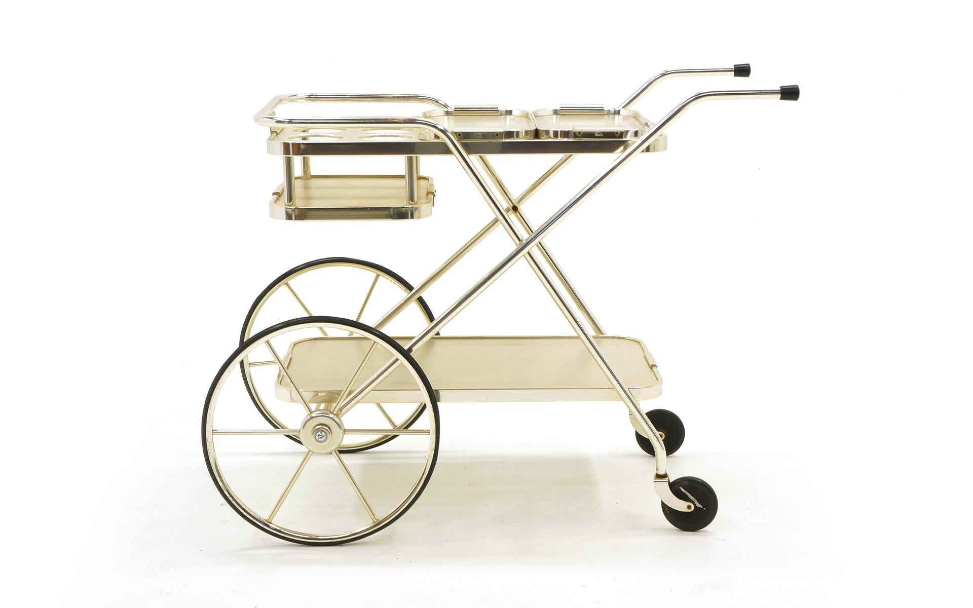 Striking Bar Trolley by Kaymet. All original wheels, casters and includes the original matching pair of serving trays. Beautiful and lightweight anodized aluminum and stainless steel. Upon close inspection there are a few small areas of loss to the