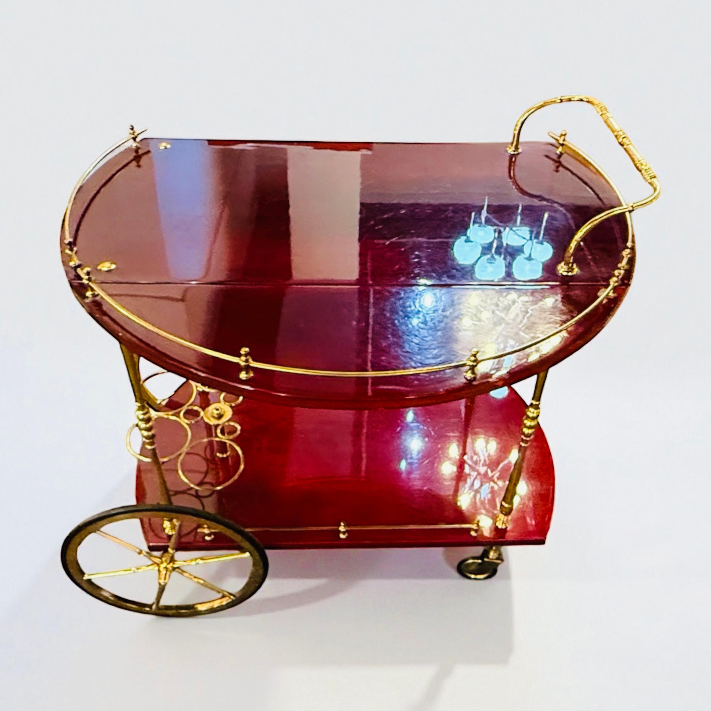 Rare Serving Bar, or Bar trolley in wood veneer RED goatskin , From Aldo Tura early 1960. Made in Italy. with two flaps of 20 cm each, making a total of 80 cm when they are all open
Very good and original condition.