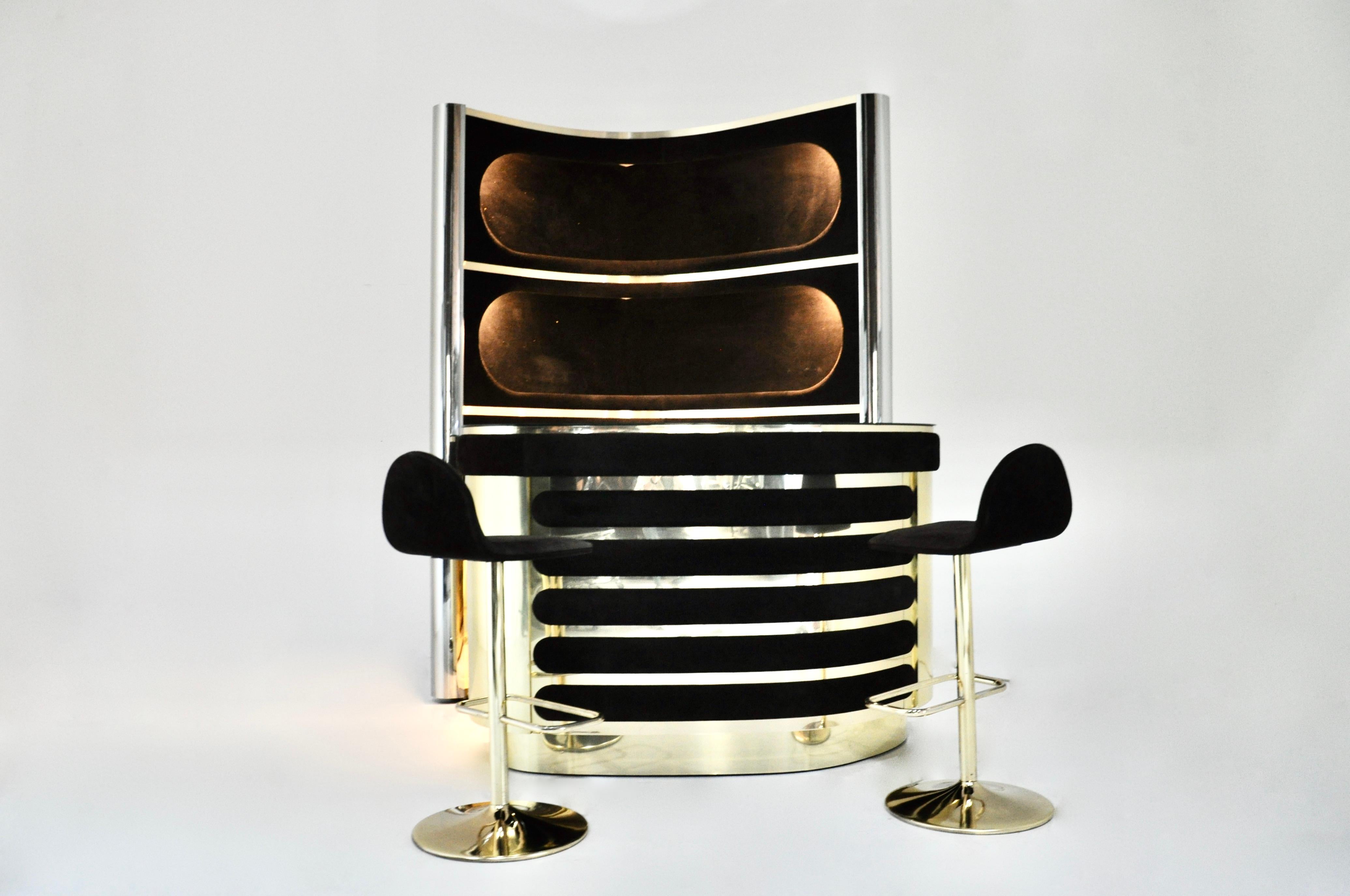 Italian bat set in the style of Willy Rizzo includes a cabinet with 3 illuminated shelves in black suede, chromed metal and brass, one of the sides at the back is mirrored glass.  It also includes a suede and brass countertop with a mirrored top, a