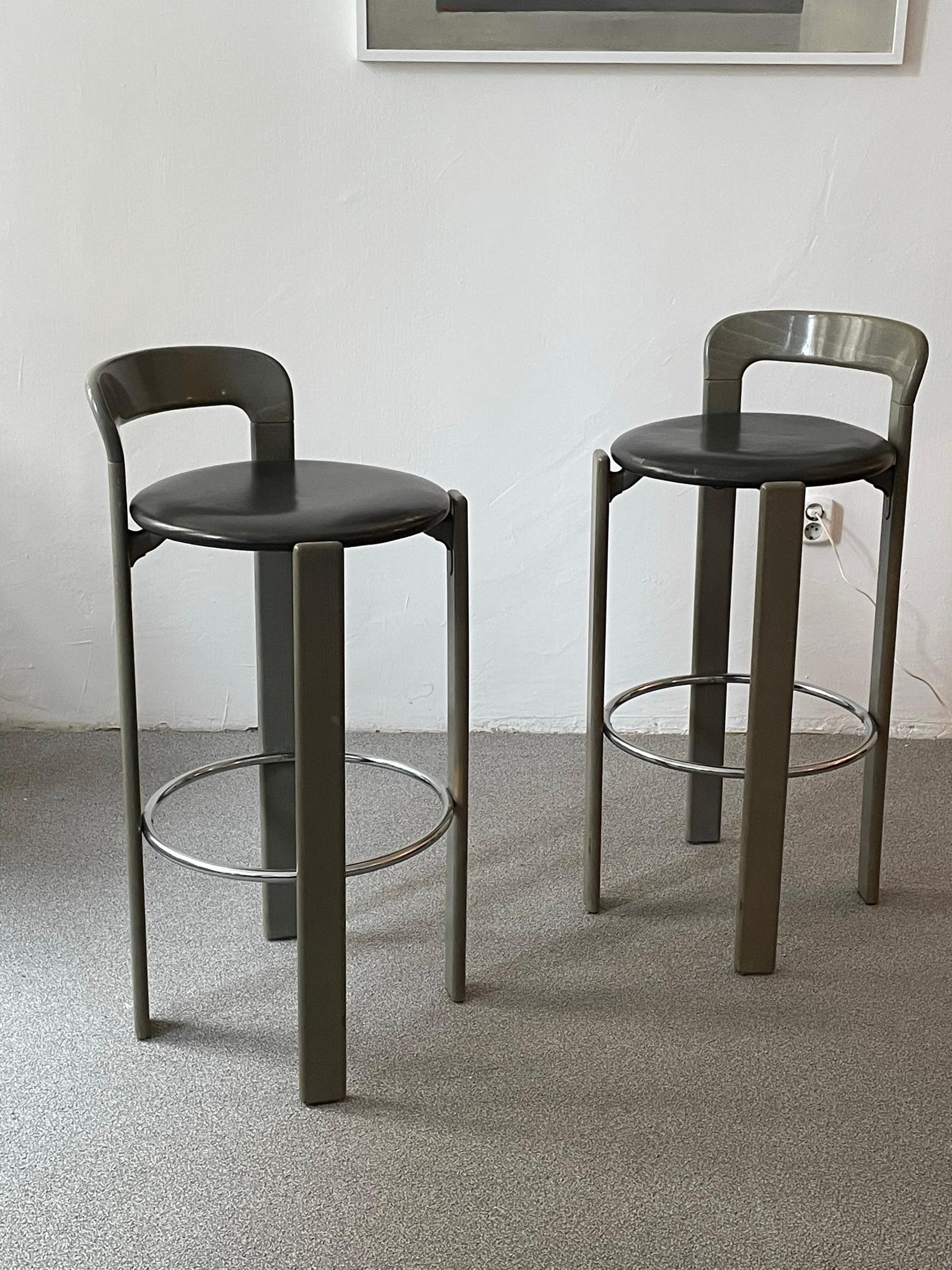 Bar stool by Bruno Rey for Dietiker.
 Made in Switzerland
The bar stool have a solid wooden frame with curved backrests . Covered in leather
 In good vintage condition, very strong and sturdy .
 Have some minor marks commensurate with age and
