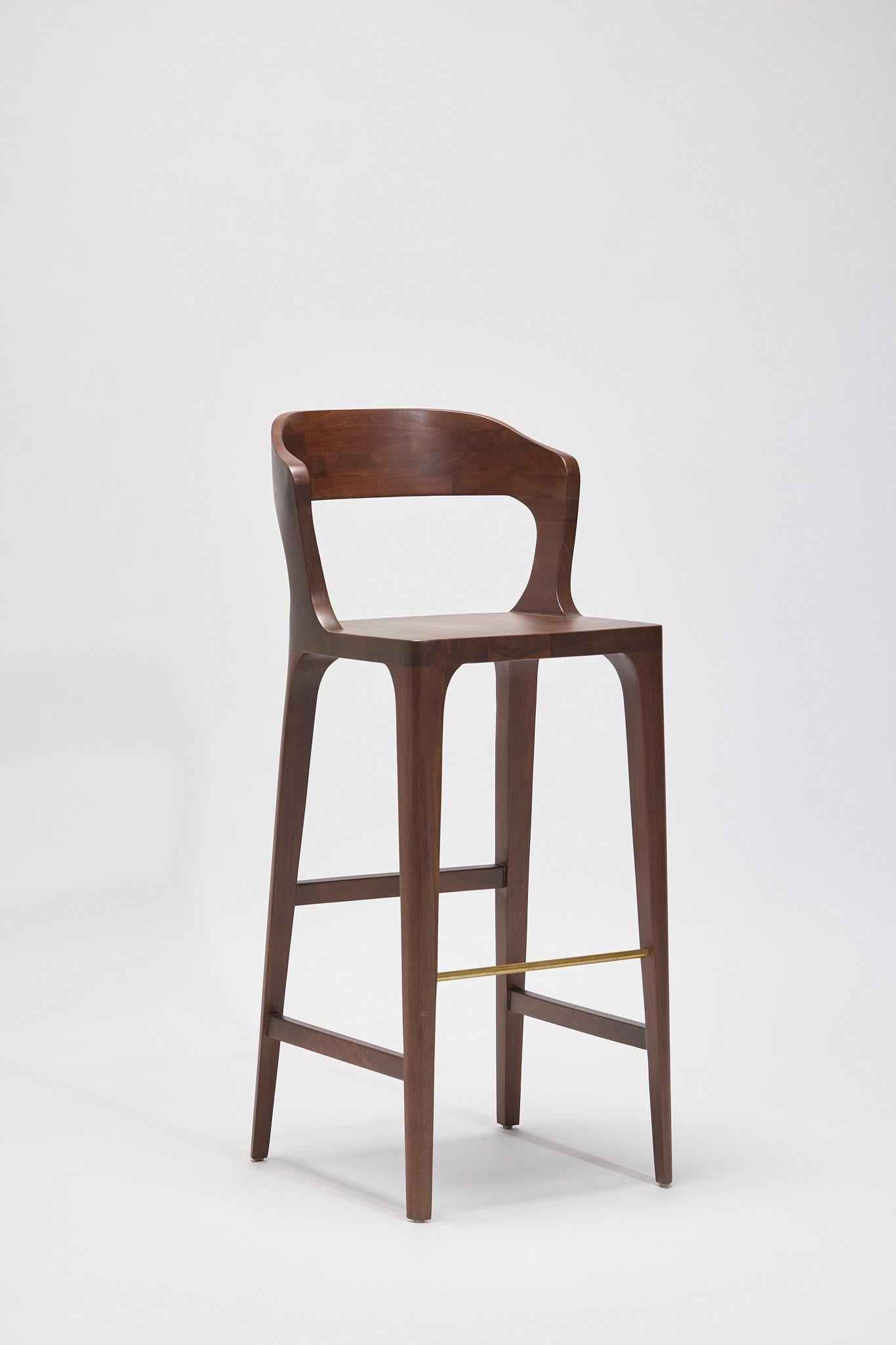 Comfortable bar stool, in US Walnut with an oiled finish

If fineness had to be incarnated by one object, without hesitation the Eileen
Chair would be it. A particular base, with a disturbing sensuality. The
delicateness of walnut invite to take
