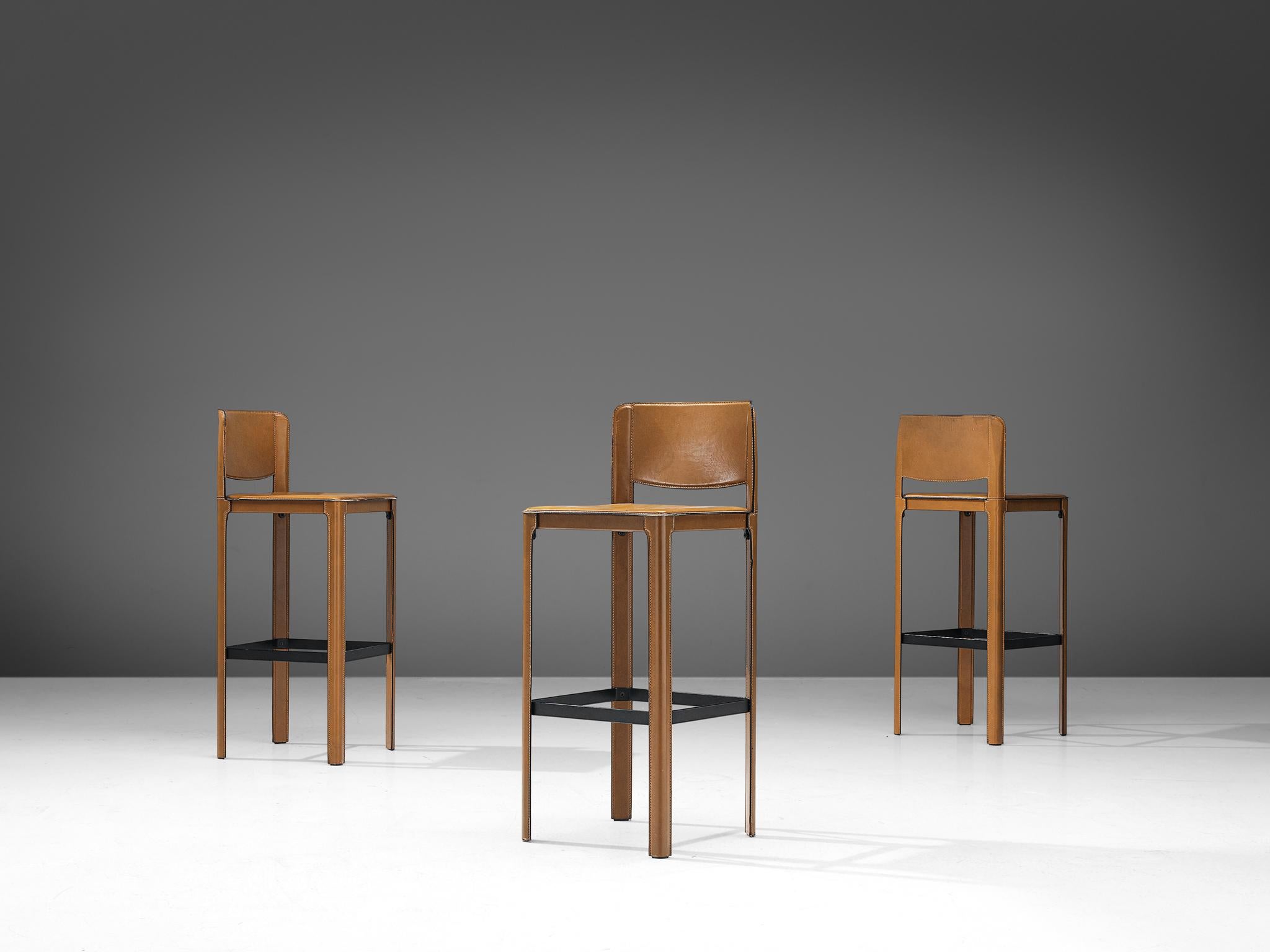 Matteo Grassi, set of three barstools, leather and metal, Italy, 1970s

Postmodern set of barstools in beautiful patinated leather, designed by Matteo Grassi. The stools are completely covered in leather, which is stitched and molded on to metal