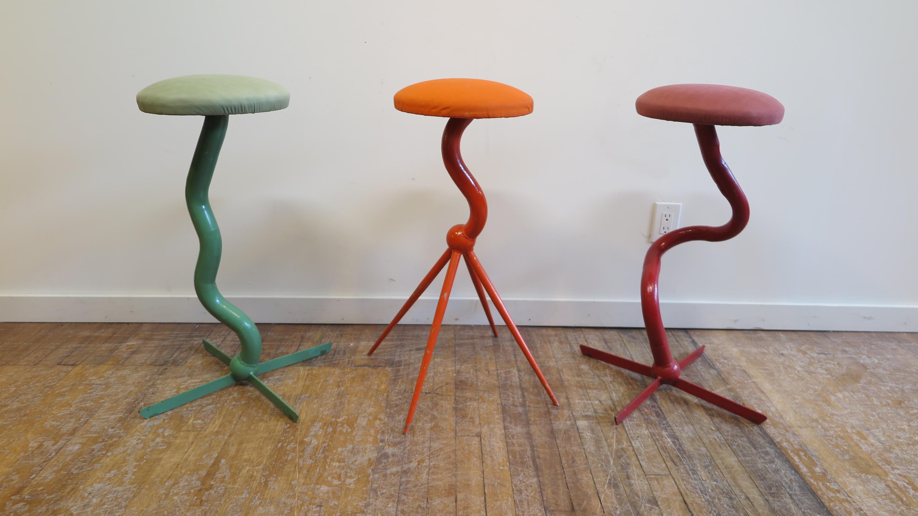 Set of three bar stools by Patrice Goujon. Stools of steel tubing coated with enamel paint. Each stool is signed and numbered as #1, #2, #3, P. Goujon, France 1990. Very strong and sturdy for every day use. Good condition. Fabric is faded metal