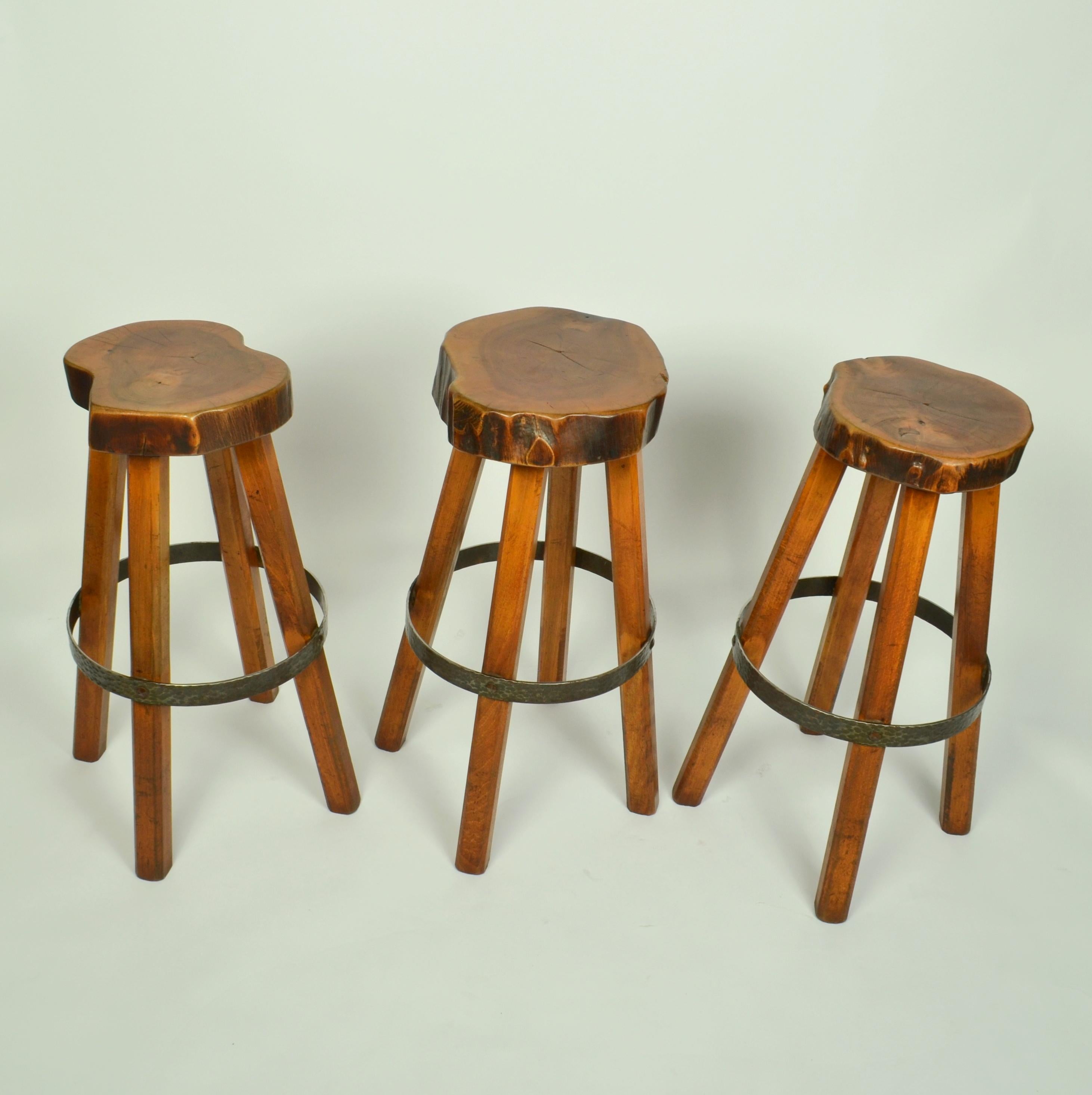 handcrafted bar stools in Burr Elm wood 1970s. These unique stools have been handmade individually, therefore each stool is unique with a freeform shape seat using the natural contours of the wood. The voluptuous four legged high stools have a