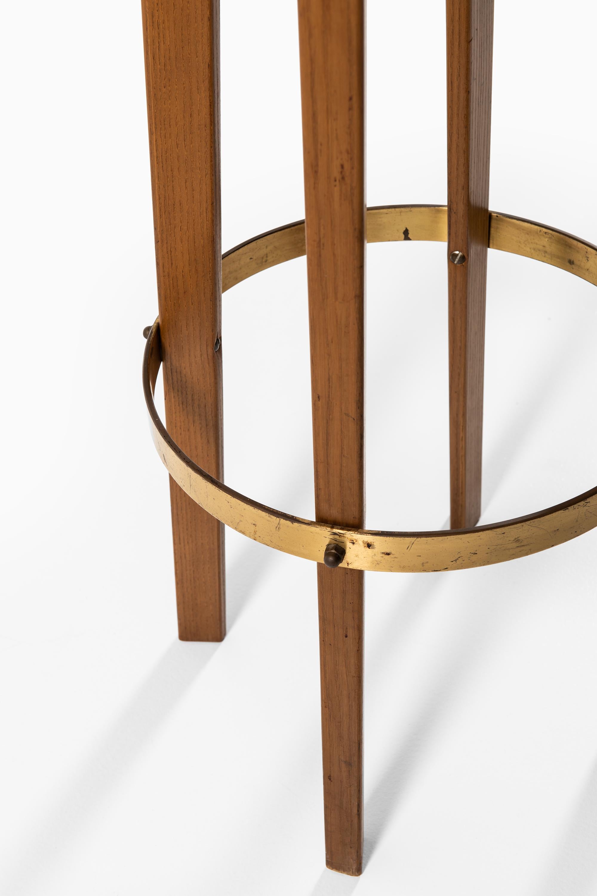 Scandinavian Modern Bar Stools in Teak, Brass and Leather Produced in Sweden