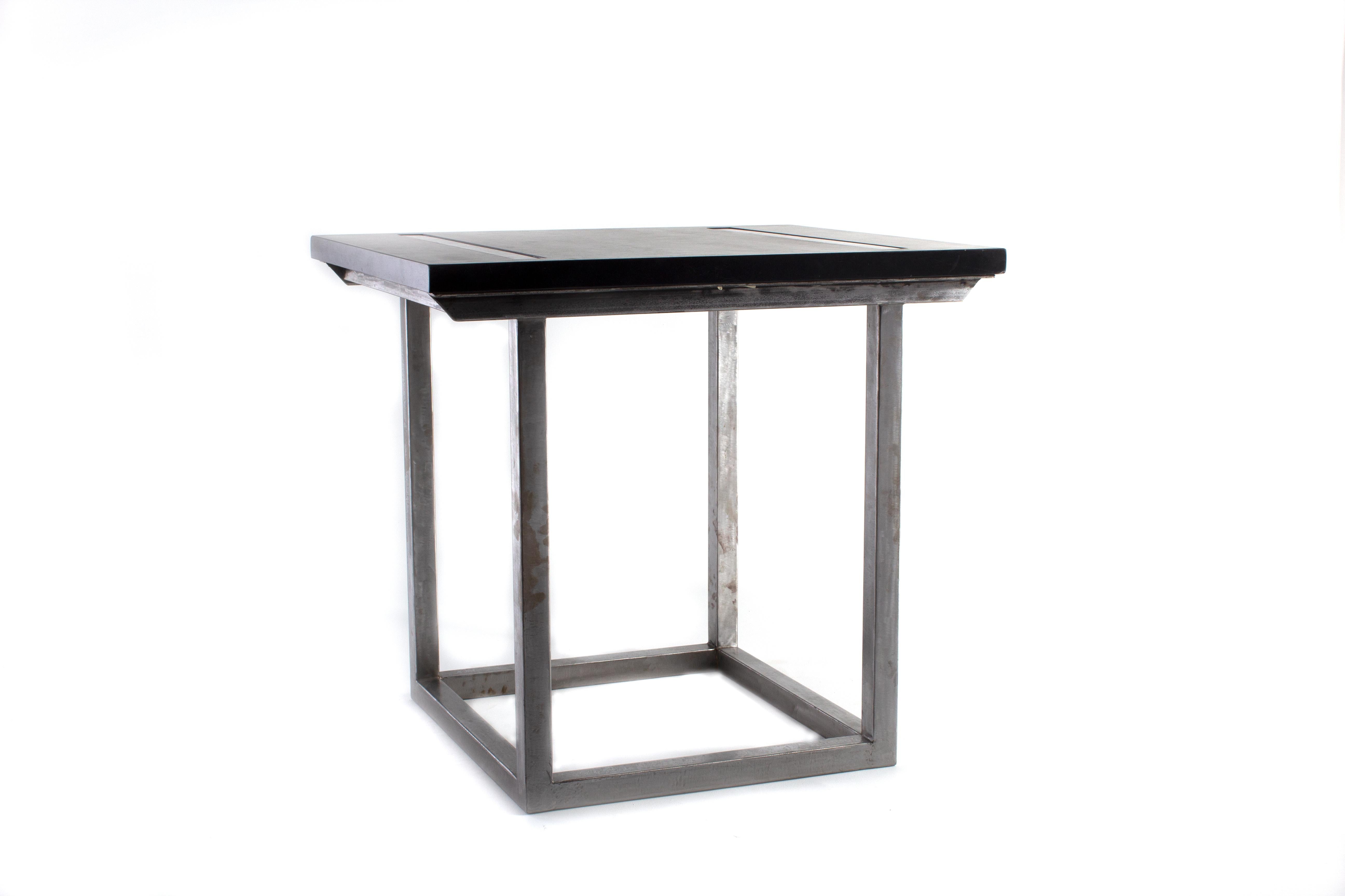 Bar table with polished steel base and ebonized limestone top.

Designed by Brendan Bass for the Vision and Design Collection, by using high quality materials and textures. All materials are sourced from local vendors throughout the state of Texas.