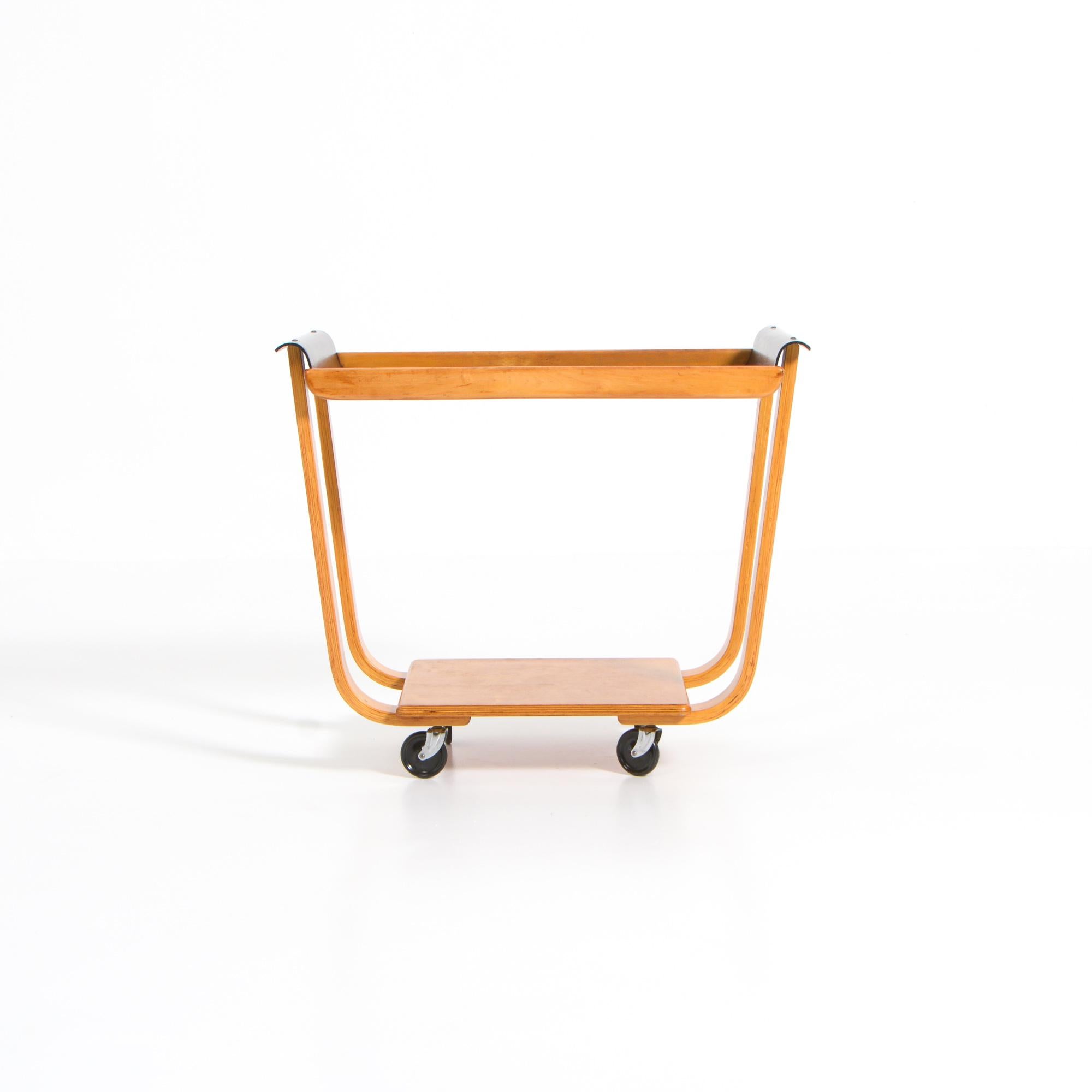 This wooden serving and bar trolley PB01 was designed by Cees Braakman for UMS Pastoe in the 1950s. The frame consists of light birch wood with a black-stained top.
This authentic piece is in very good condition, with normal signs of age and use for