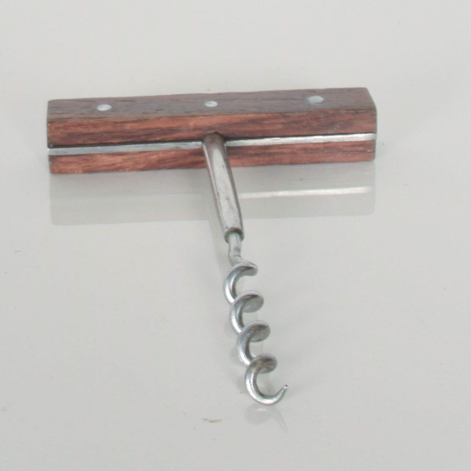 For your consideration: Vintage Mid-Century Modern wine bottle bar corkscrew opener.
Made in stainless steel with rosewood handles. Stamped 