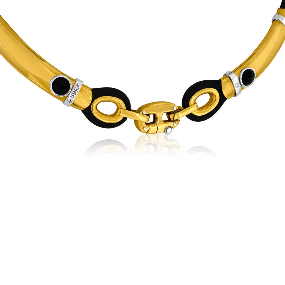 Designer BARAKA
18K Yellow & White Gold on Black Rubber Necklace
The necklace is 16