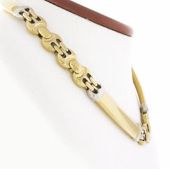 Baraka, collana girocollo in oro 18 carati bicolore con maglie curve e circolari