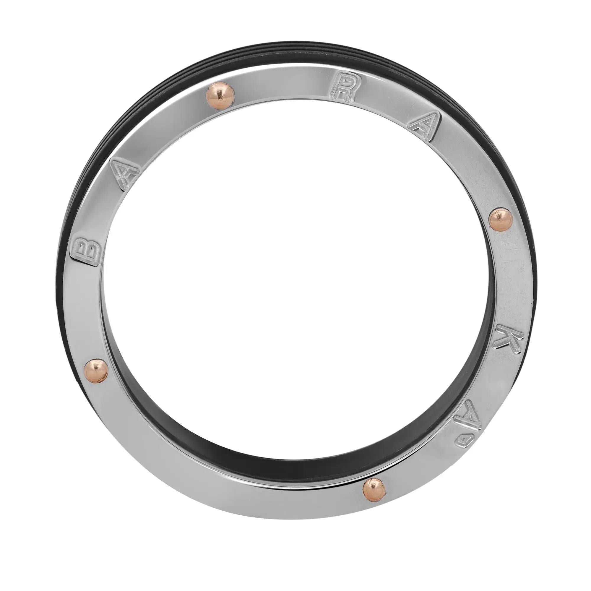 This stylish men's wedding band ring is lovingly fabricated in smooth 18K white gold with rose gold accents, steel and black PVD. Ring size: 11.25. Ring width: 6.5mm. This ring is a store display model and does not come with the original box and