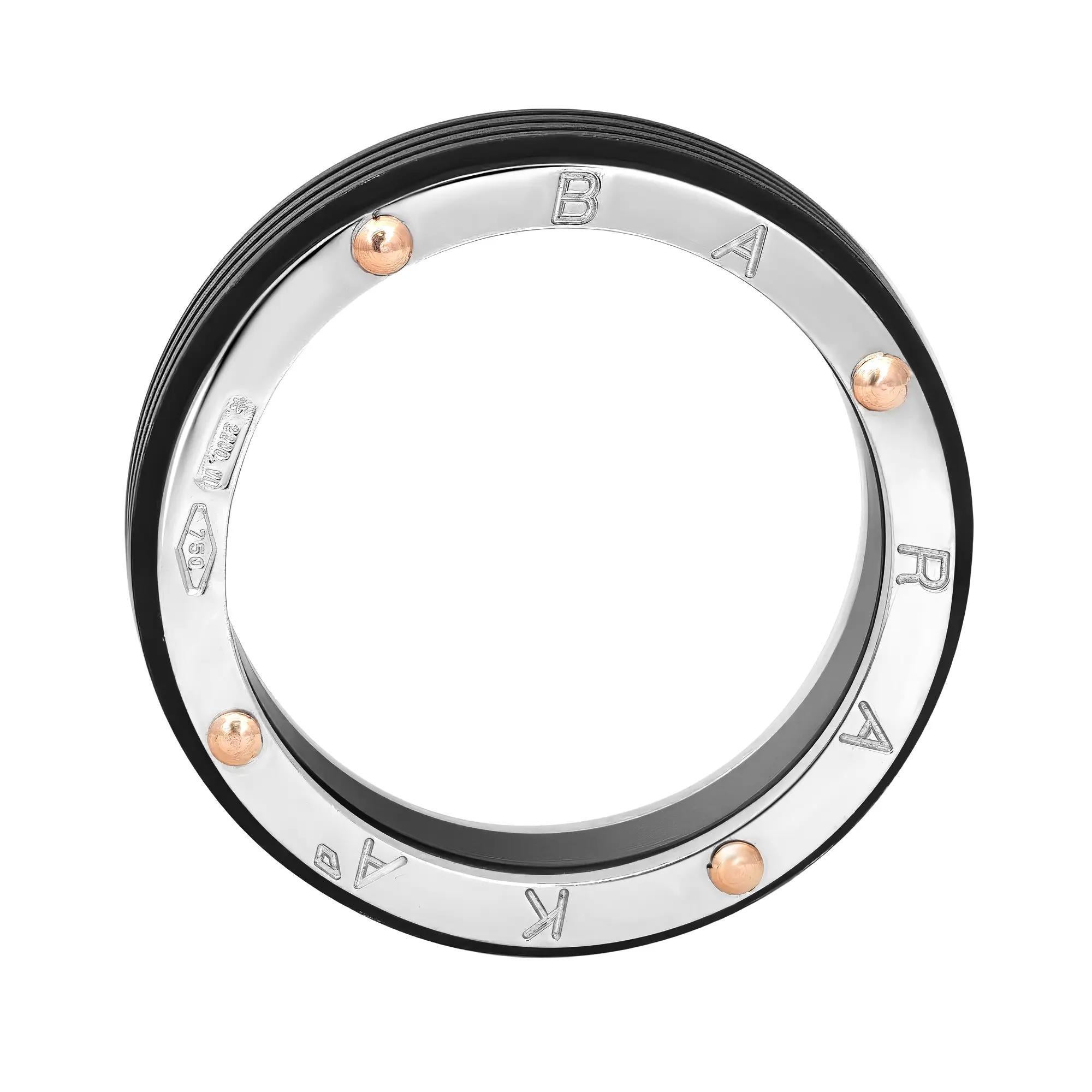 This stylish men's wedding band ring is lovingly fabricated in smooth 18K white gold with rose gold accents and black PVD. Ring size: 7.5. Ring width: 6.3mm. This ring is a store display model and does not come with the original box and papers. Made
