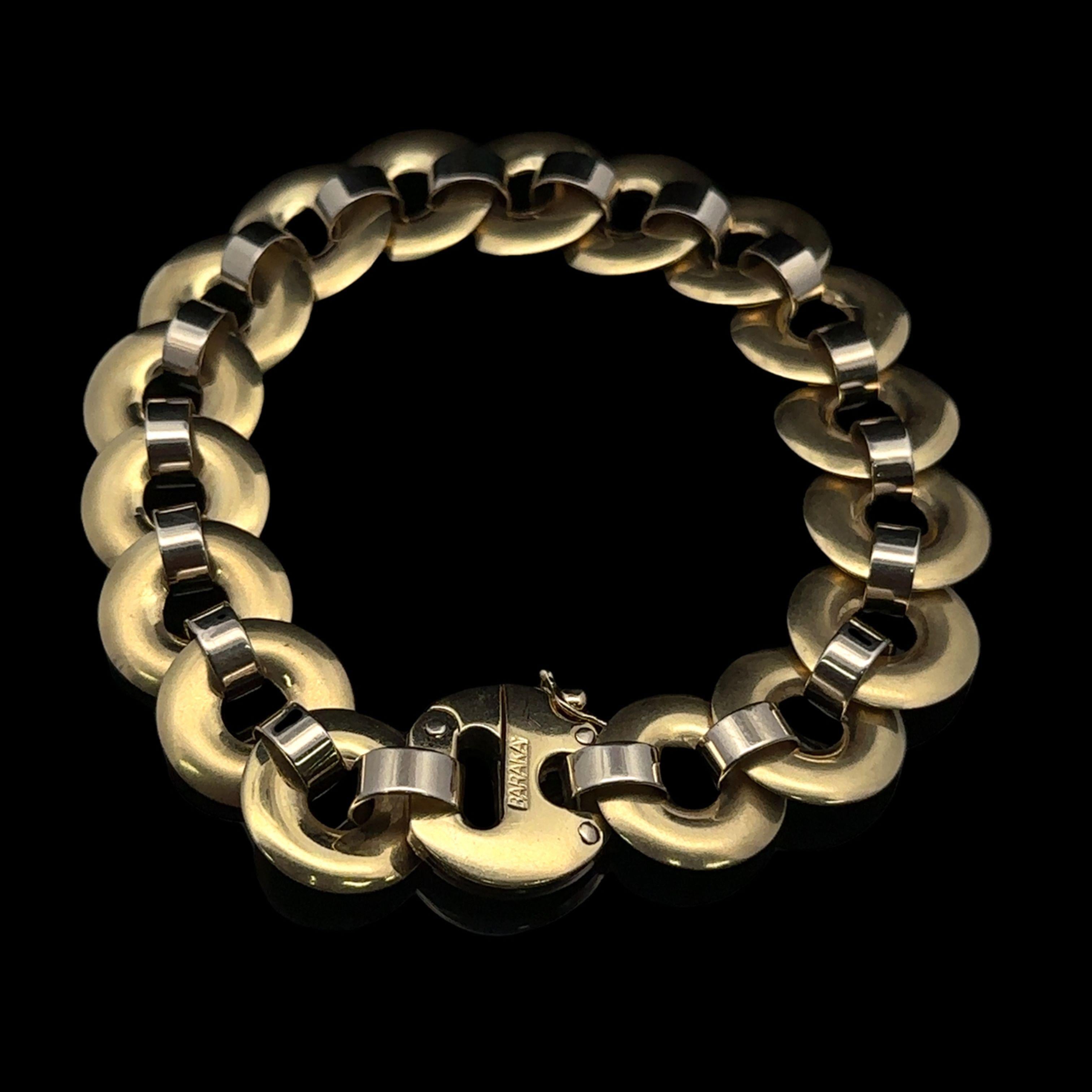 MATERIAL : Or jaune massif 14k avec accents en or blanc
Poids : 40,70 grammes
Type de chaîne : Maillons circulaires
Longueur de la chaîne : Mesure 8.25 pouces à la règle. S'adapte confortablement à un poignet de 7,5 pouces.
Fermeture : Fermeture à
