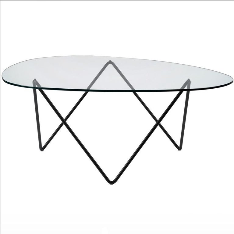 Barba Corsini Pedrera coffee table in black for Gubi. The Pedrera coffee table was designed in 1955 by Barba Corsini for the loft space at La Pedrera, the famous landmark in Barcelona. Executed in glass with a black powder painted metal base, the
