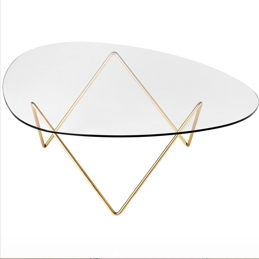 Barba Corsini Pedrera coffee table in brass for Gubi. The Pedrera coffee table was designed in 1955 by Barba Corsini for the loft space at La Pedrera, the famous landmark in Barcelona. Executed in glass with a brass-plated metal base, the table fits