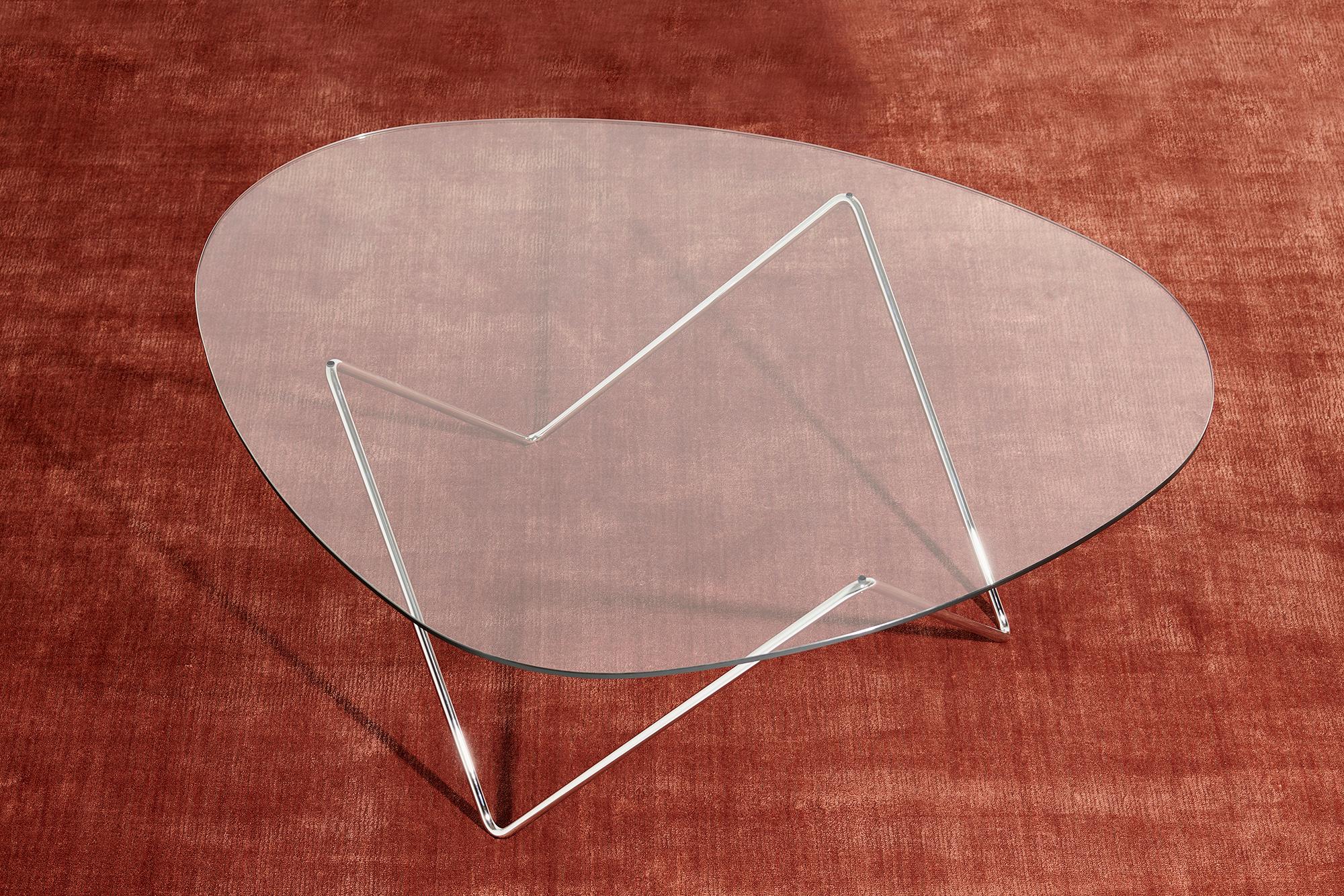 Barba Corsini Pedrera coffee table in chrome for Gubi. The Pedrera coffee table was designed in 1955 by Barba Corsini for the loft space at La Pedrera, the famous landmark in Barcelona. Executed in glass with a chrome base, the table fits well into