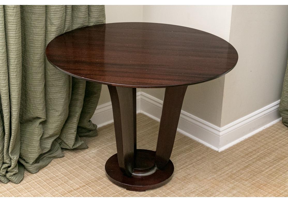 A later design by Barbara Barry for Baker Furniture. Dark Mahogany with handsome graining in a Tulip form reminiscent of the great Art Deco Era. Refined simplicity of form adds style to this piece which may be used as a Center, Occasional , End or