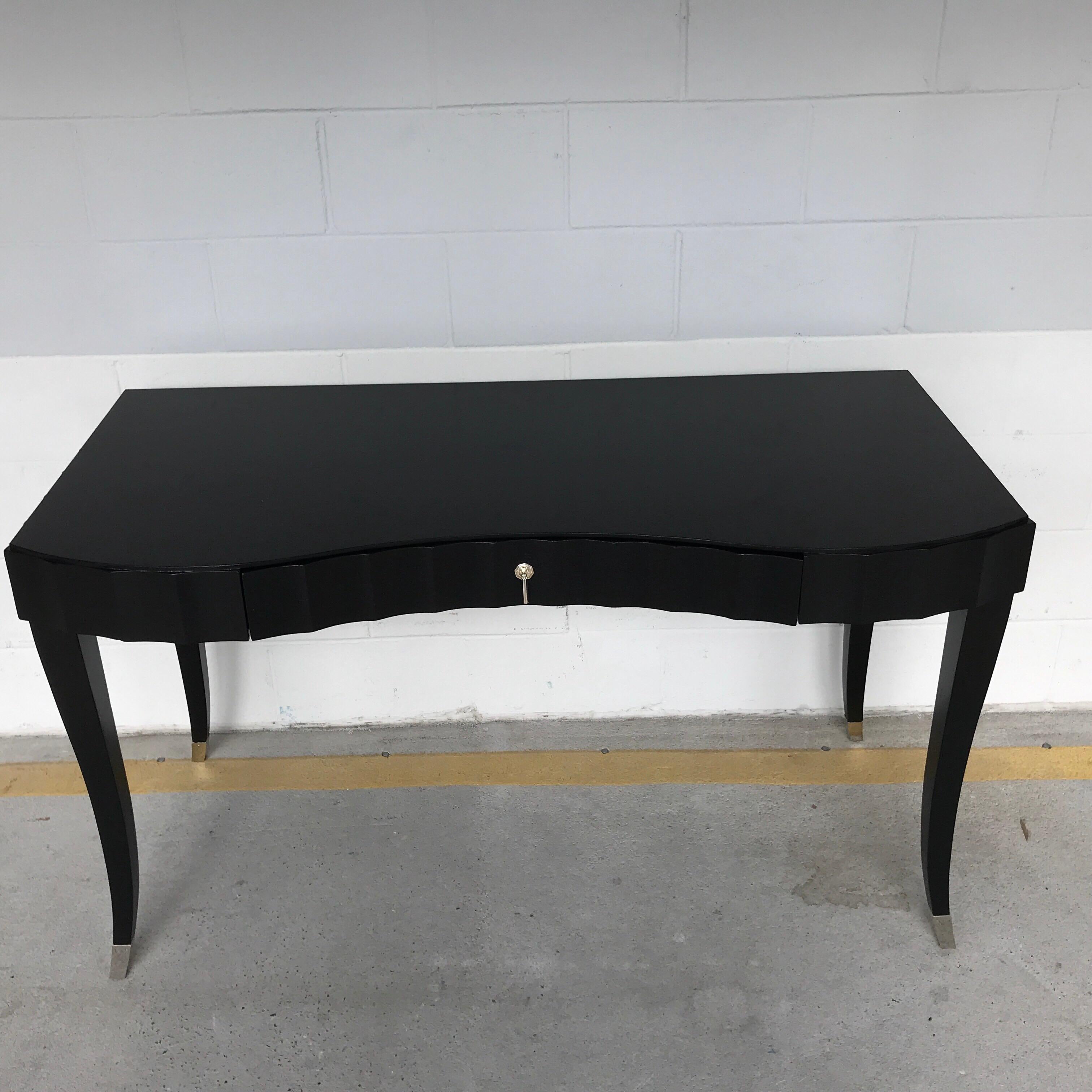 Barbara Barry for baker black lacquered desk or vanity. Beautiful black lacquer shapely case fitted with one 28