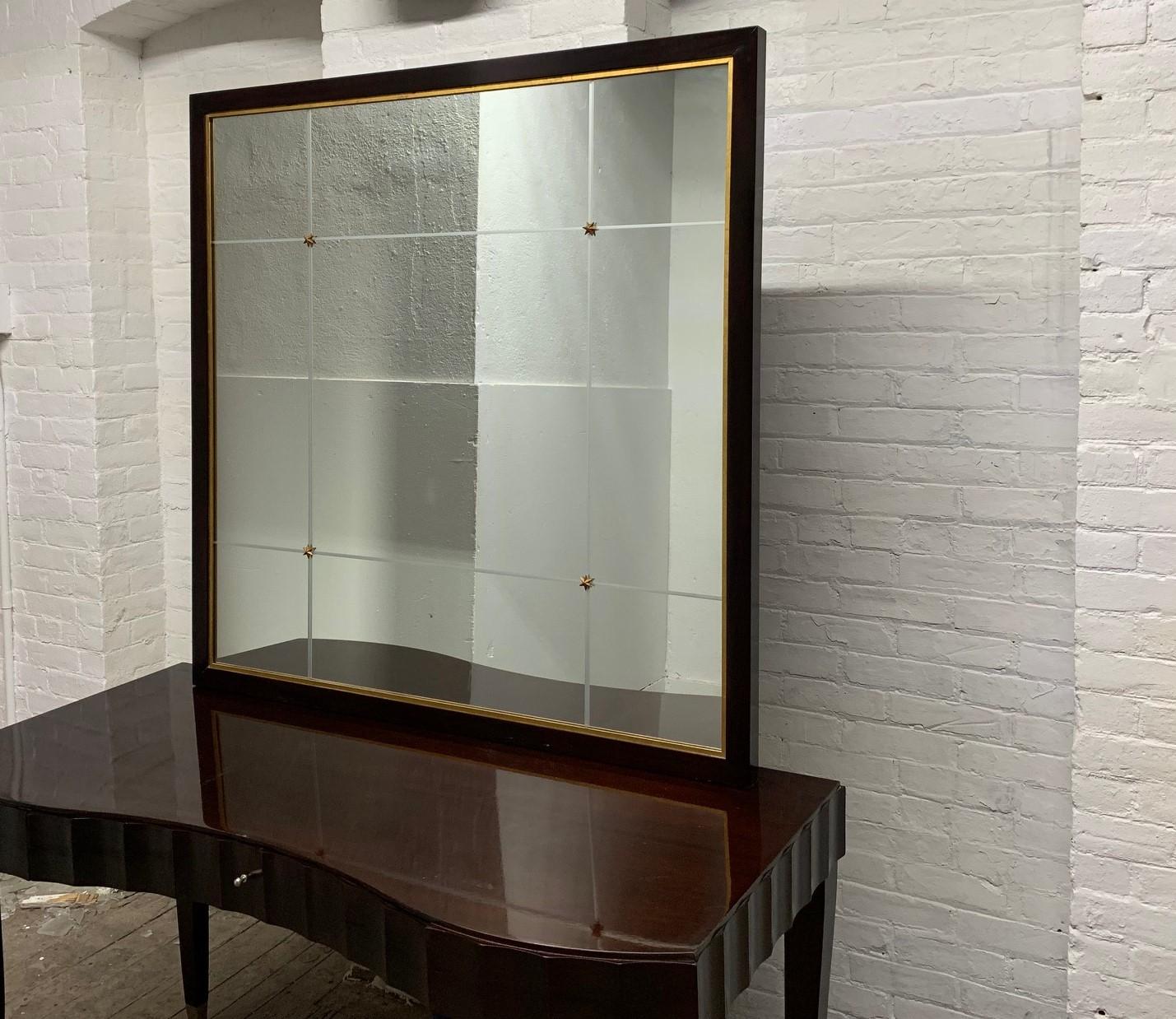 Barbara Barry for Baker Furniture Co Mahogany Mirror. The mirror is etched forming nine square and rectangular shapes with gilded star motifs. The mirror has a matching desk and chair listed separately.