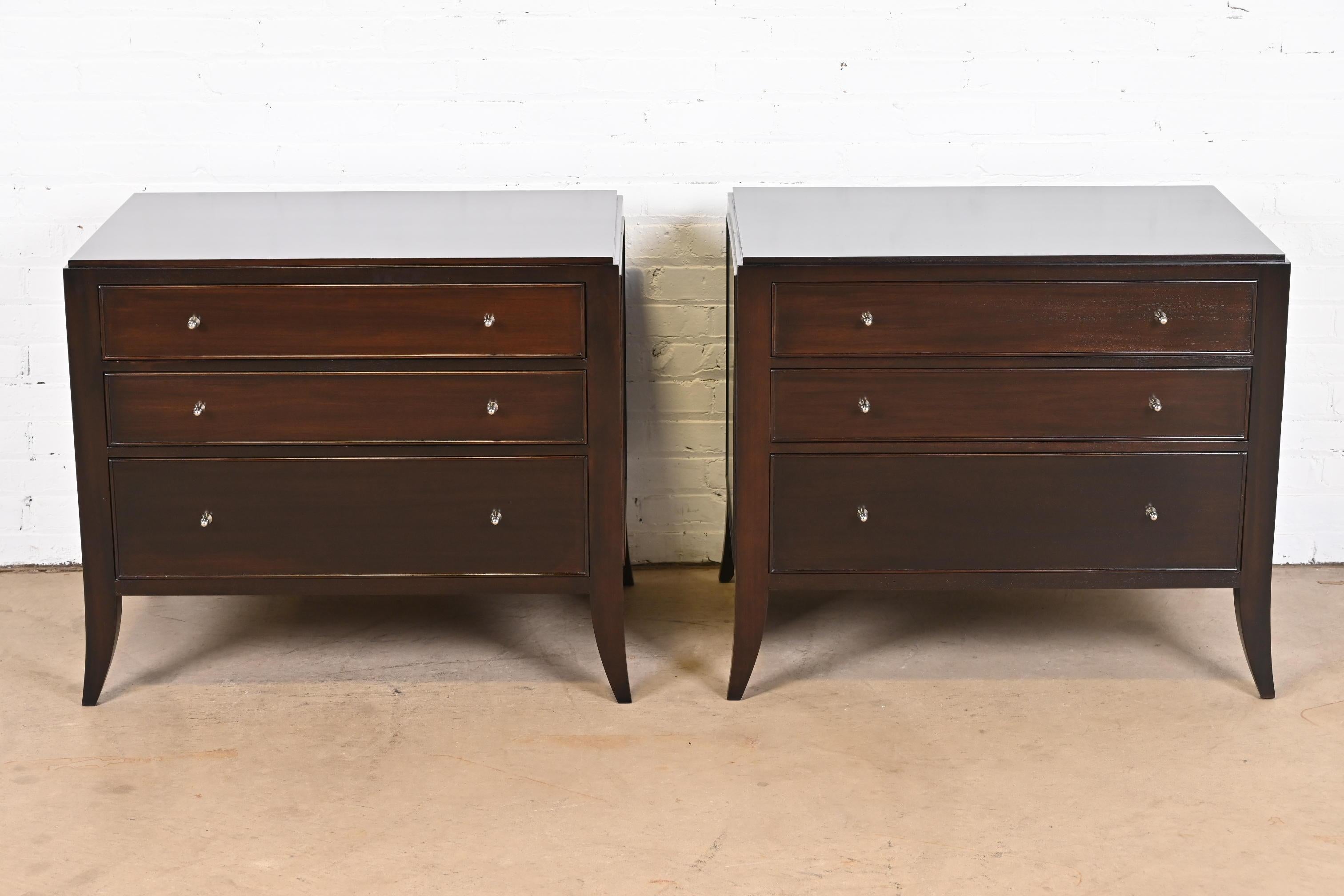 An exceptional pair of Modern Regency style three-drawer nightstands or bachelor chests

By Barbara Barry for Baker Furniture

USA, Circa 1990s

Dark mahogany, with original nickel hardware.

Measures: 32