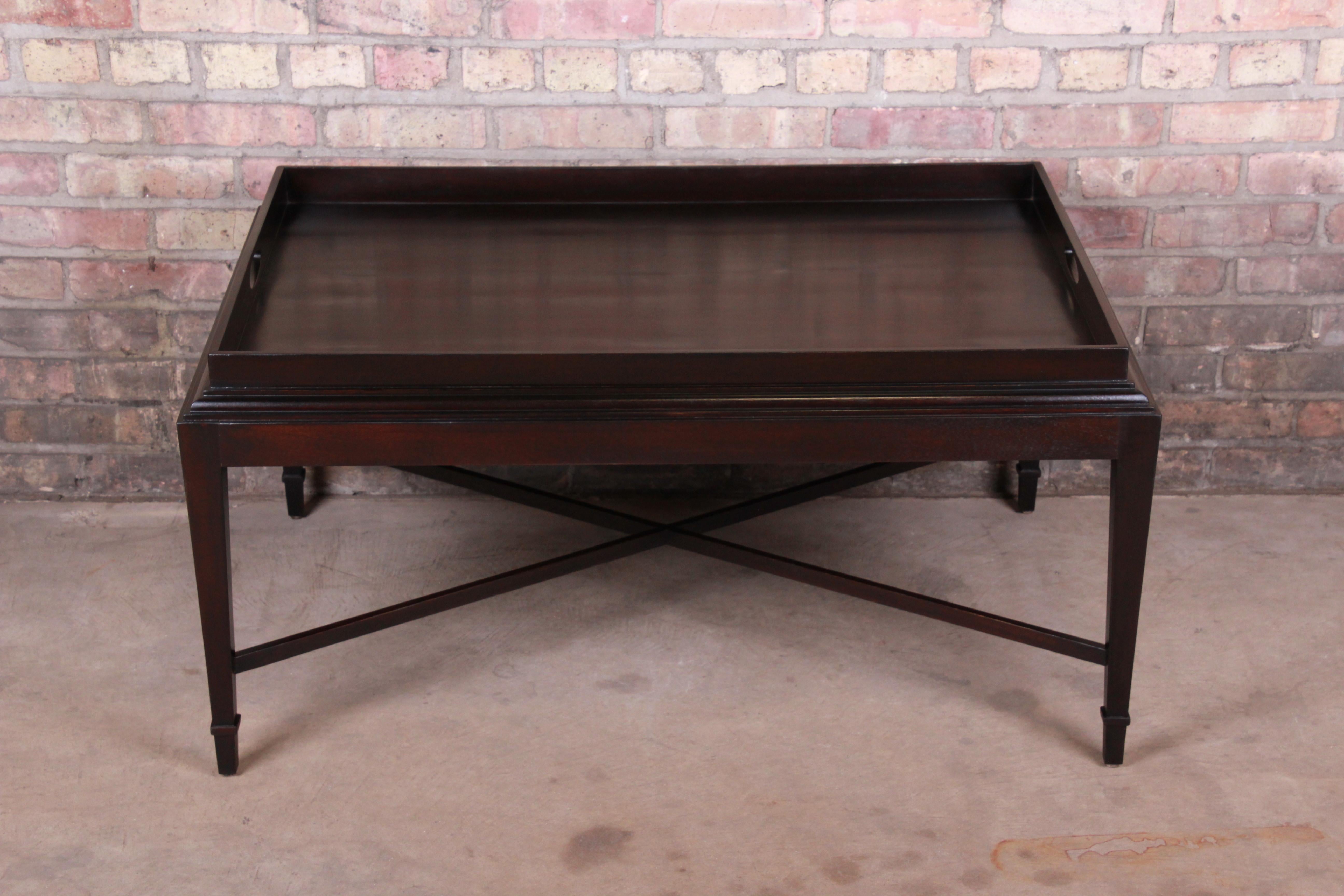 A stylish modern coffee or cocktail table

By Barbara Barry for Baker Furniture

USA, circa 1990s

Dark mahogany, with X-base stretchers.

Measures: 39.13