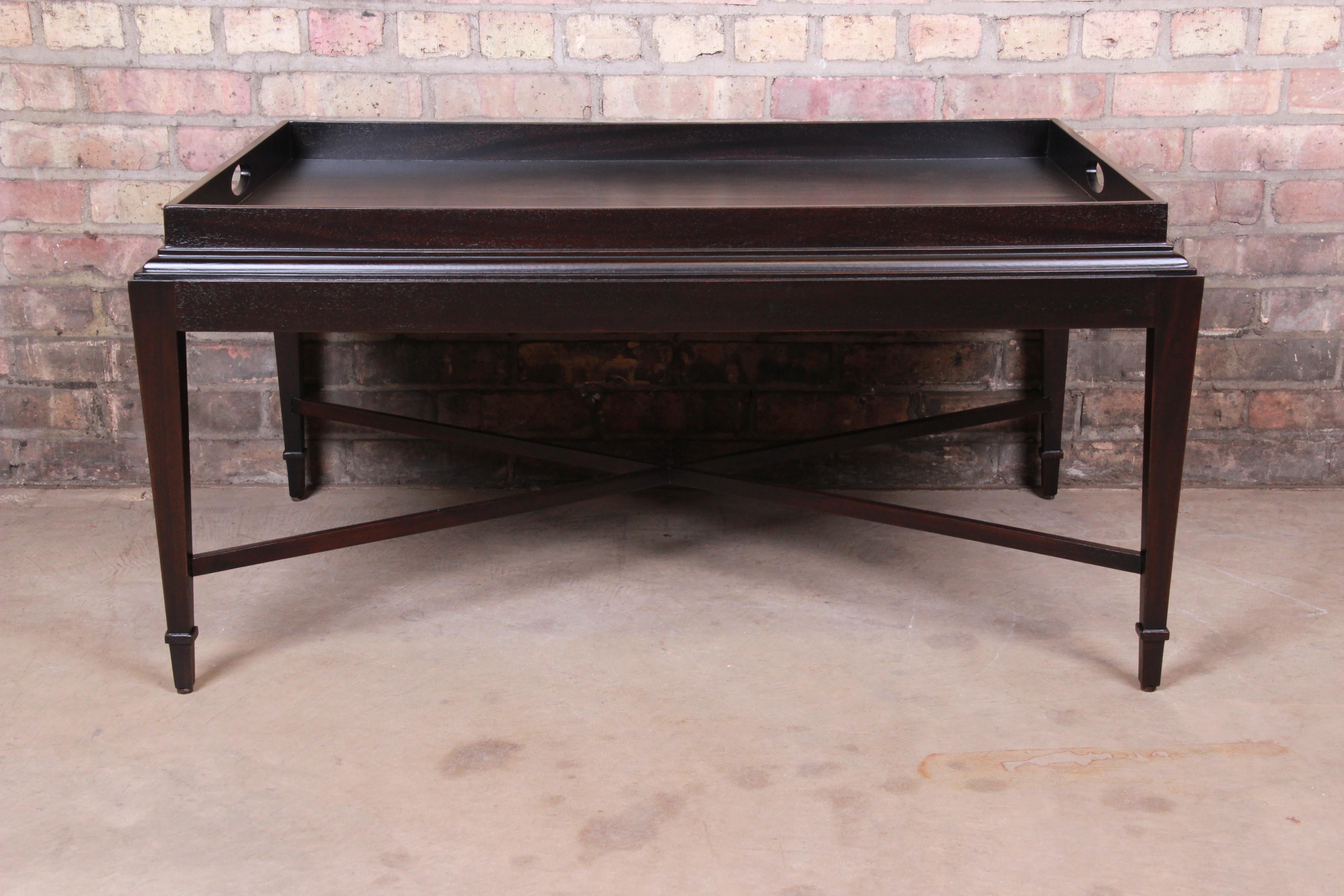 An exceptional modern coffee or cocktail table

By Barbara Barry for Baker Furniture

USA, circa 1990s

Dark mahogany, with X-base stretchers.

Measures: 40