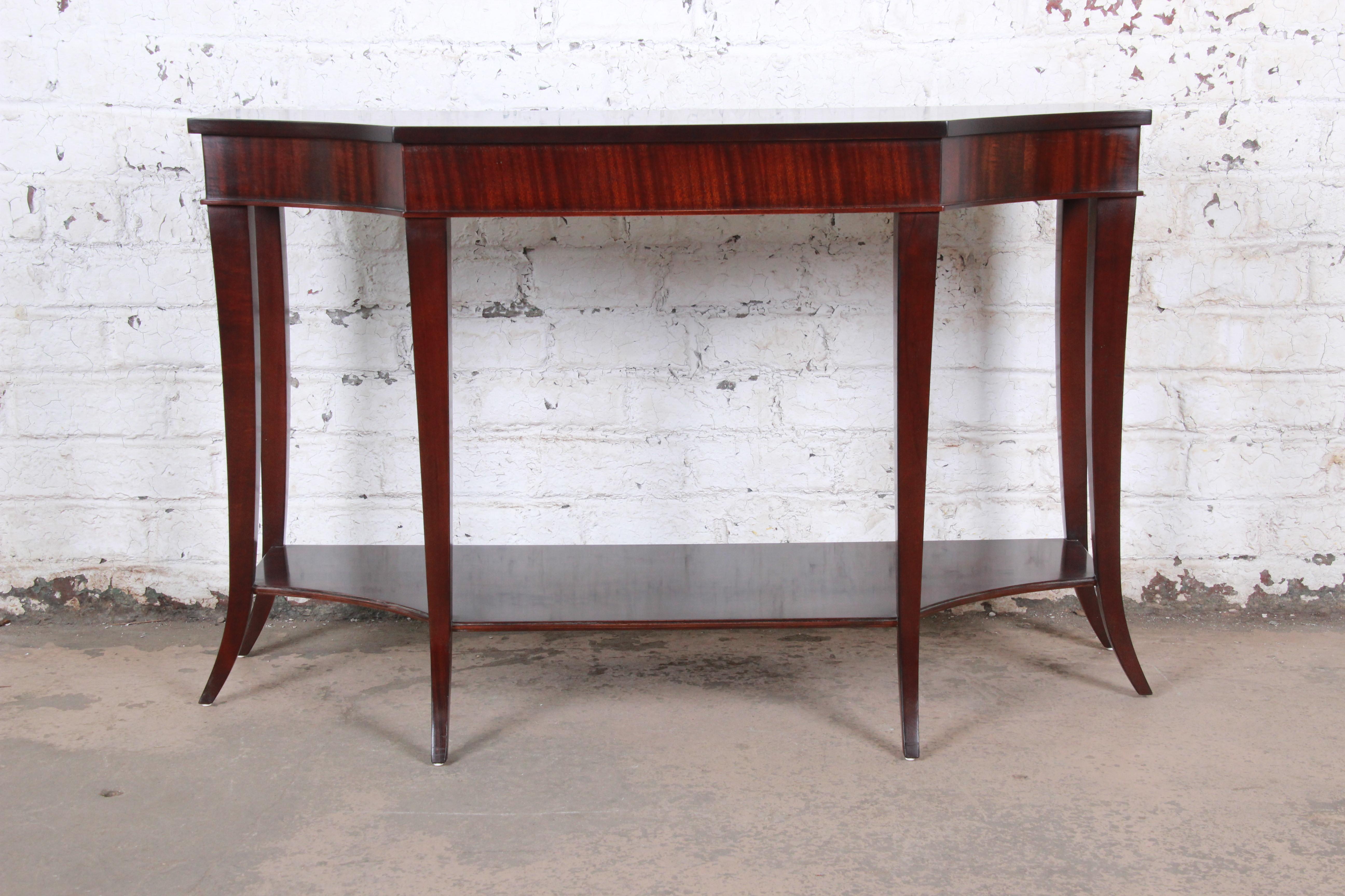 A gorgeous dark mahogany modern sofa table or console with elegant saber legs

By Barbara Barry for Baker Furniture

USA, circa 2000

Measures: 48