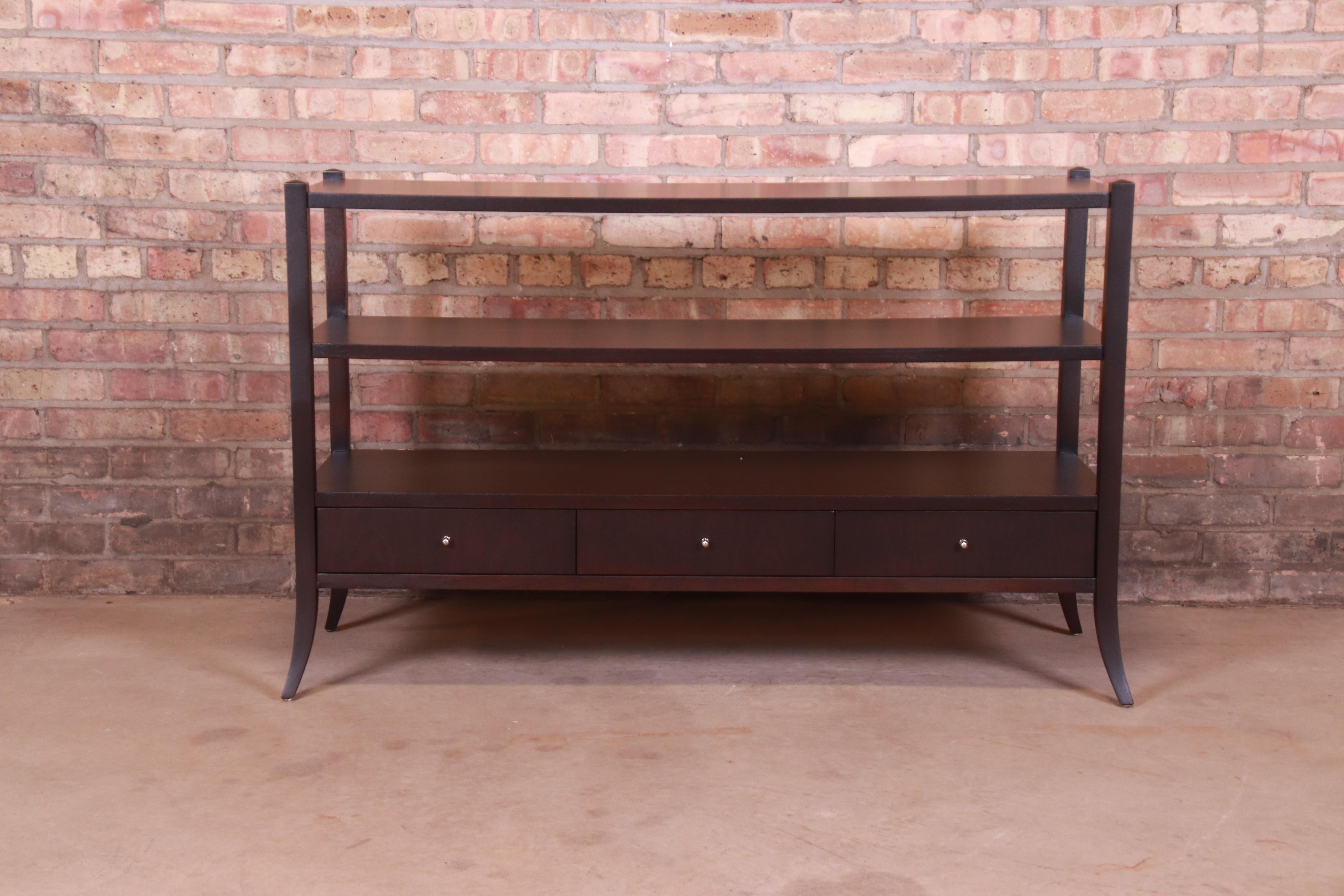 An exceptional contemporary three-tier dark mahogany console table

By Barbara Barry for Baker Furniture

USA, Circa 1990s

Measures: 49.5