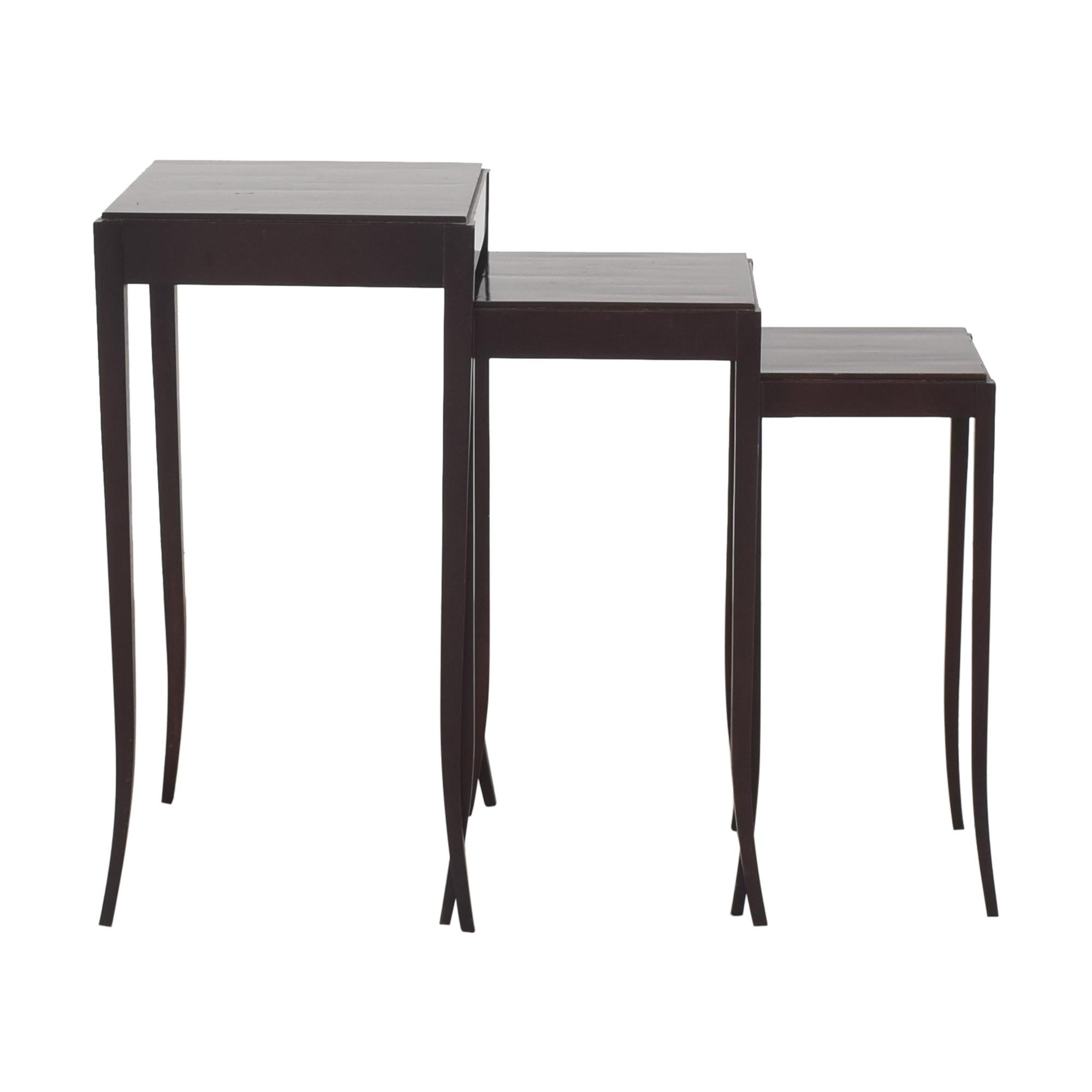 Crafted in hand-planed mahogany, these charming high-heeled tables are a delicate, but chic work of art. Lovely sinuous lines. Custom original finish. This listing is for one set of three nesting tables, as pictured. 

Dimensions:
H-29